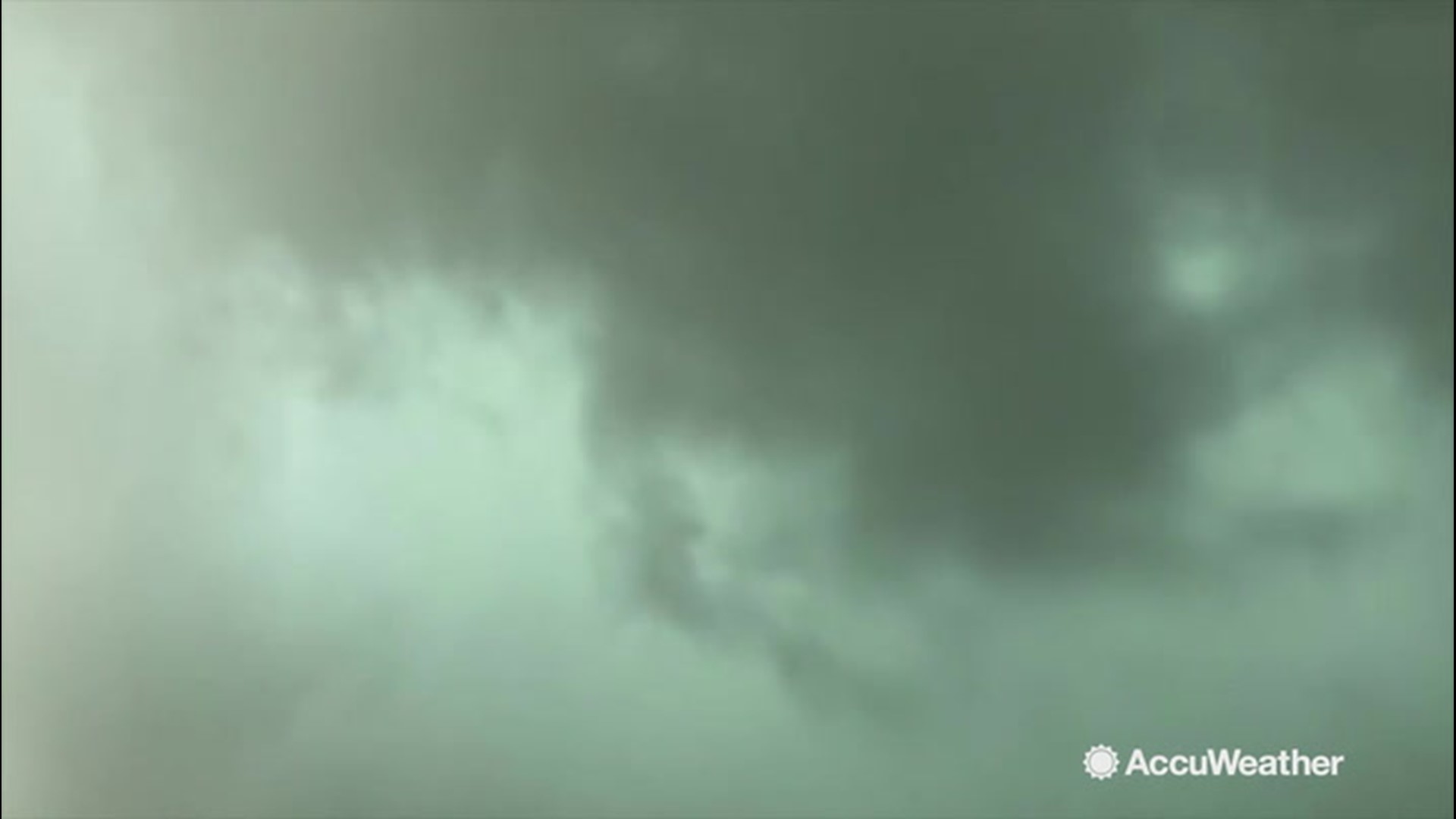 Storm chaser Reed Timmer captured this look at a funnel cloud concealed within heavy rainfall in Bethune, Colorado, on Aug. 13.