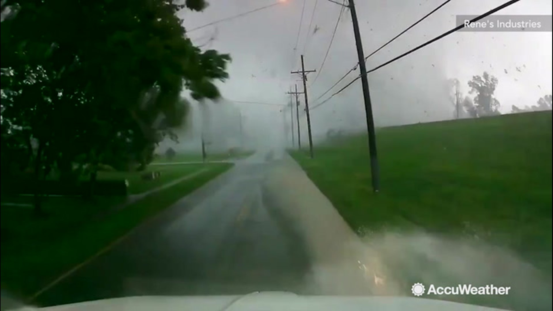 This tornado was spotted sending debris flying and causing power lines to ignite sparks in Convent, Louisiana, on June 6. It crossed the road right in front of the driver in this video.