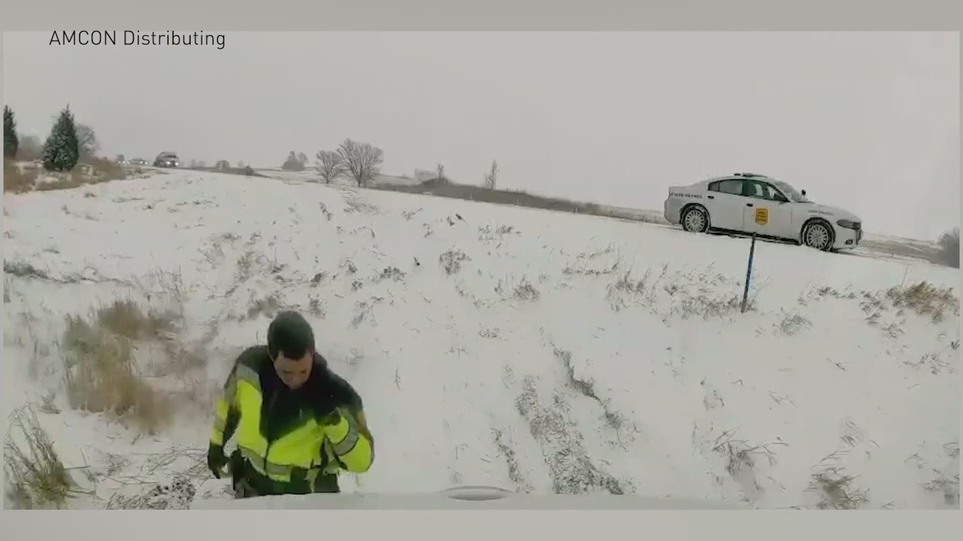 A truck's dash cam captured a close call when a pick-up veered off the road during inclement weather, nearly hitting a state trooper and another driver.