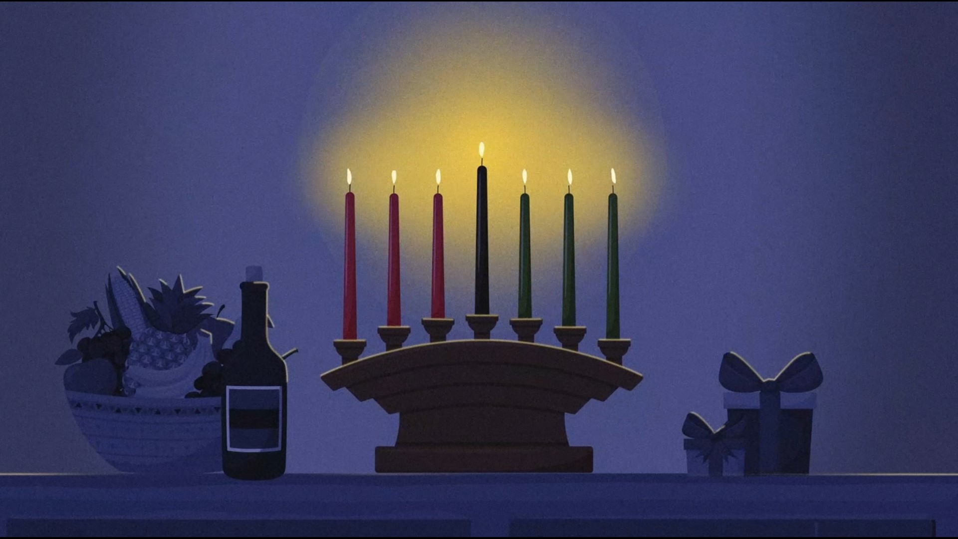 A video loop featuring festive music and the candles which represent the seven principles of Kwanzaa.