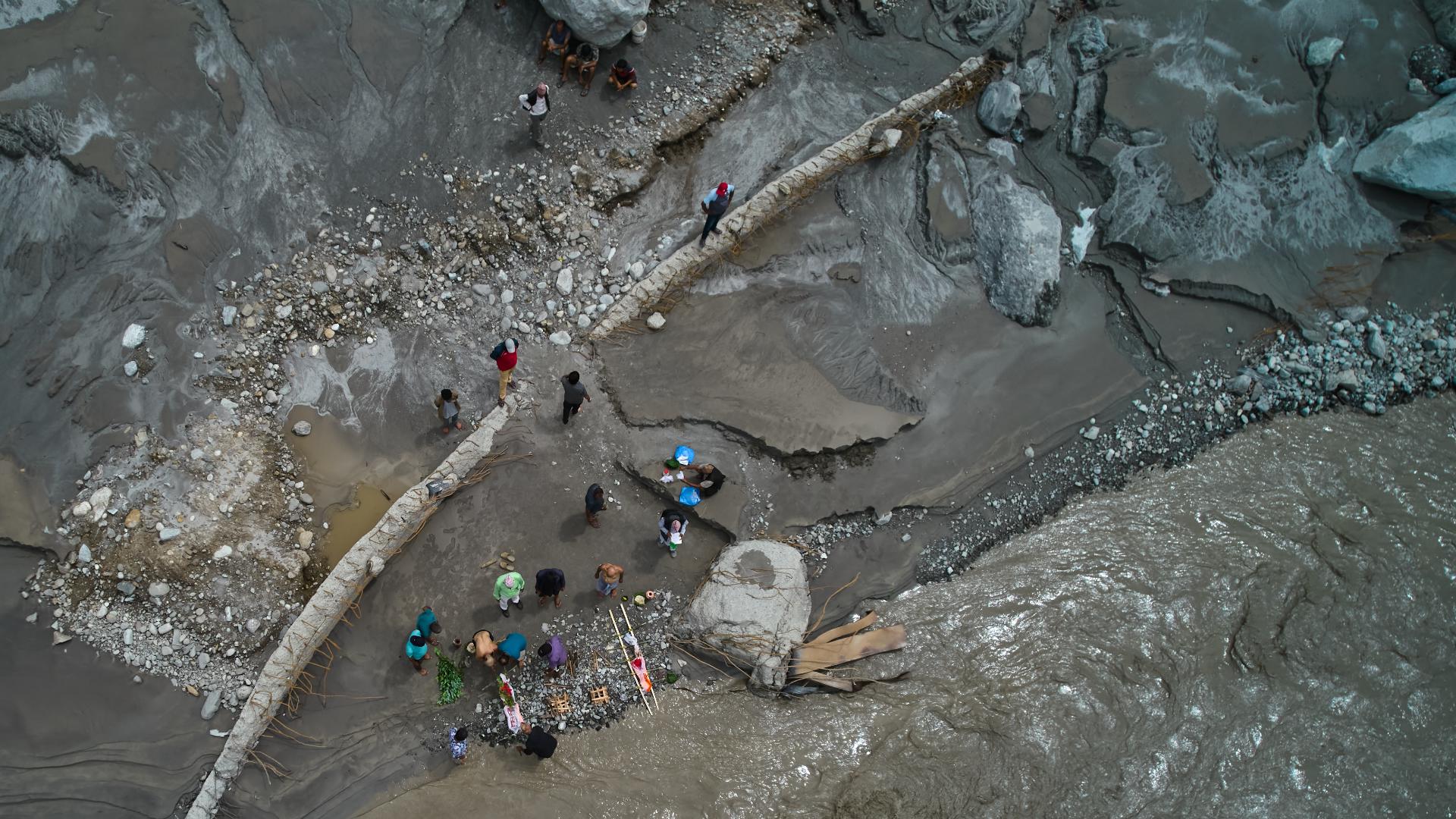 Symbolic funerals held in Nepal for those feared lost with dozens of Americans still missing