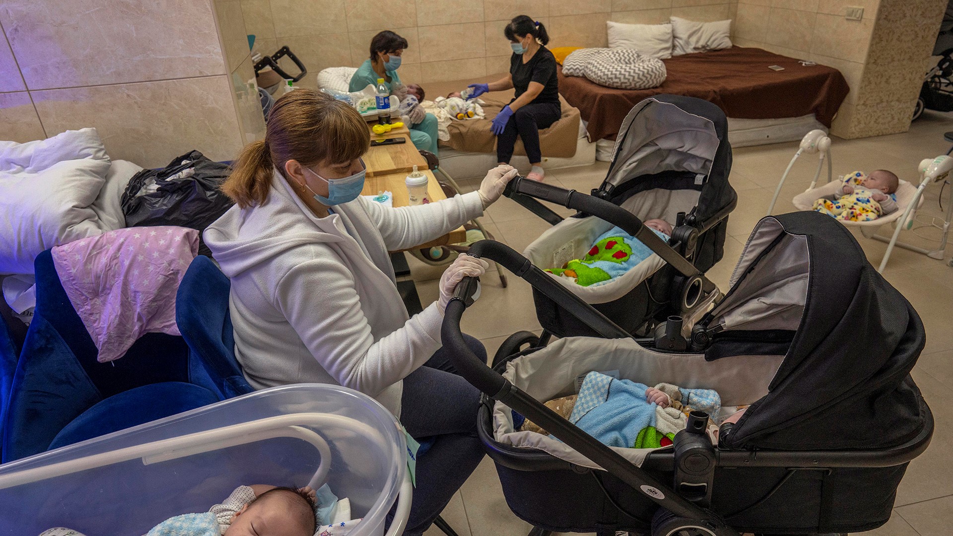 More than 20 newborns are waiting for surrogate parents to collect them in Ukraine capital of Kyiv while under the care of nurses in a makeshift nursery.