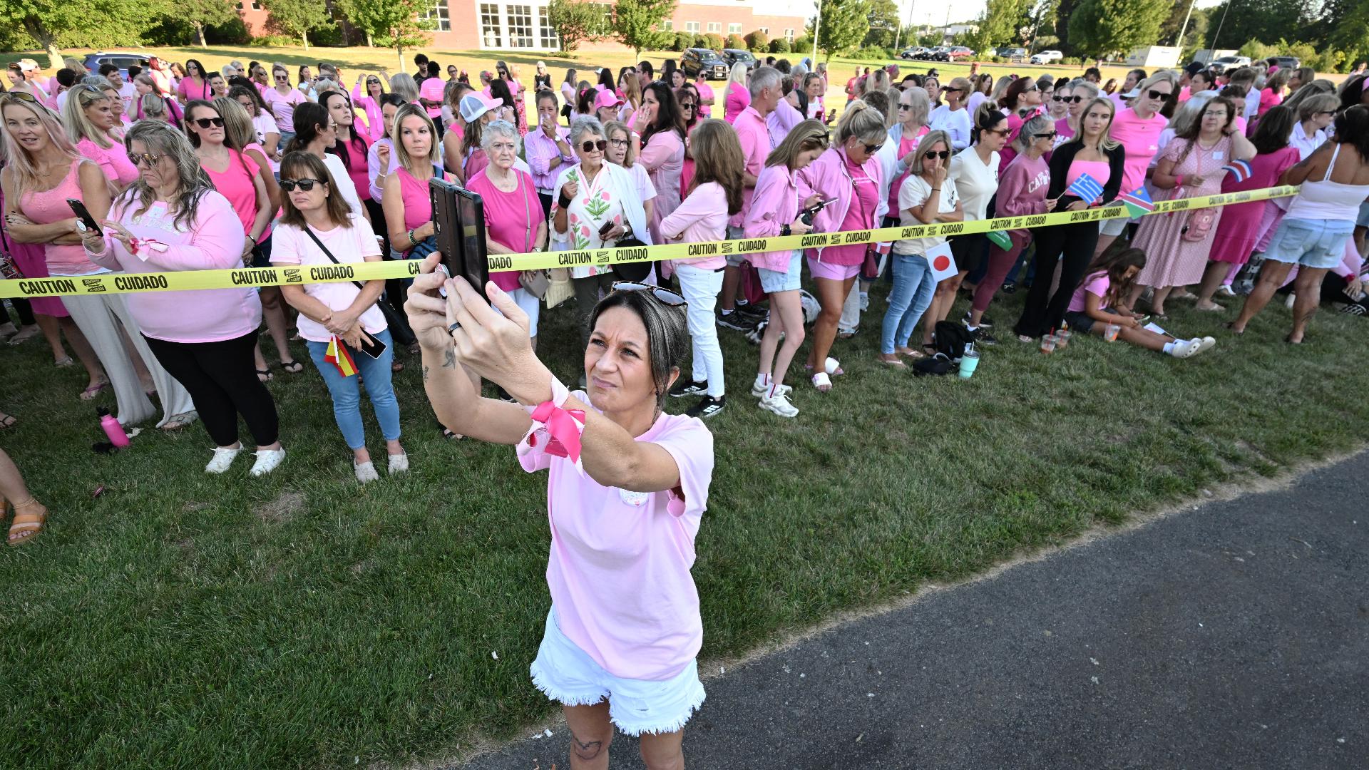 Hundreds of women wear pink at rally in support of Lindsay Clancy, who is on trial for killing her 3 children