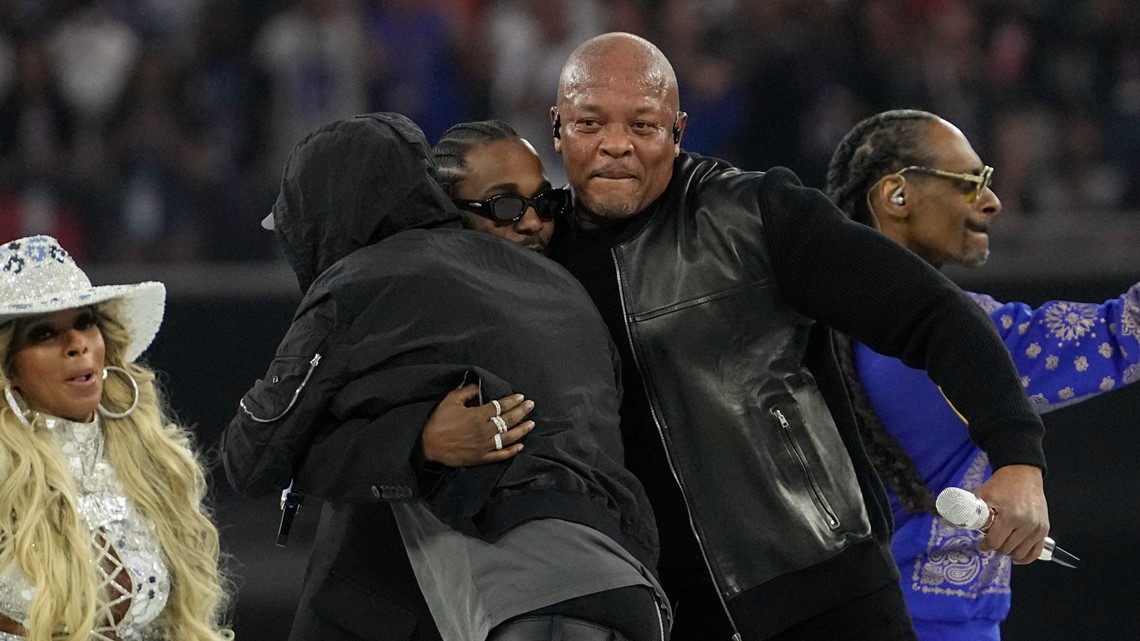 Dr. Dre raps anti-cop lyric, Eminem kneels in nod to Kaepernick during  Super Bowl halftime show - Washington Times