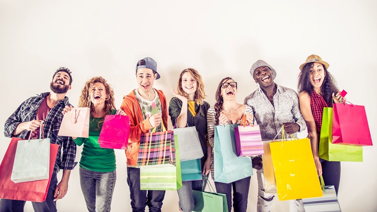 Several people holding shopping bags