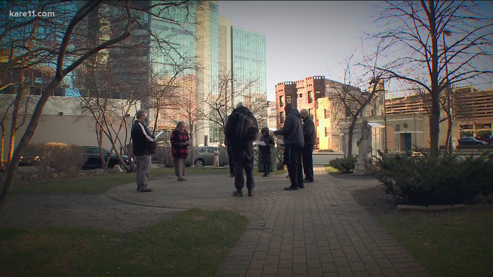 Father Kevin Kenney leads a prayer service every morning at 8 a.m. in a neighborhood park just blocks away from the courthouse.