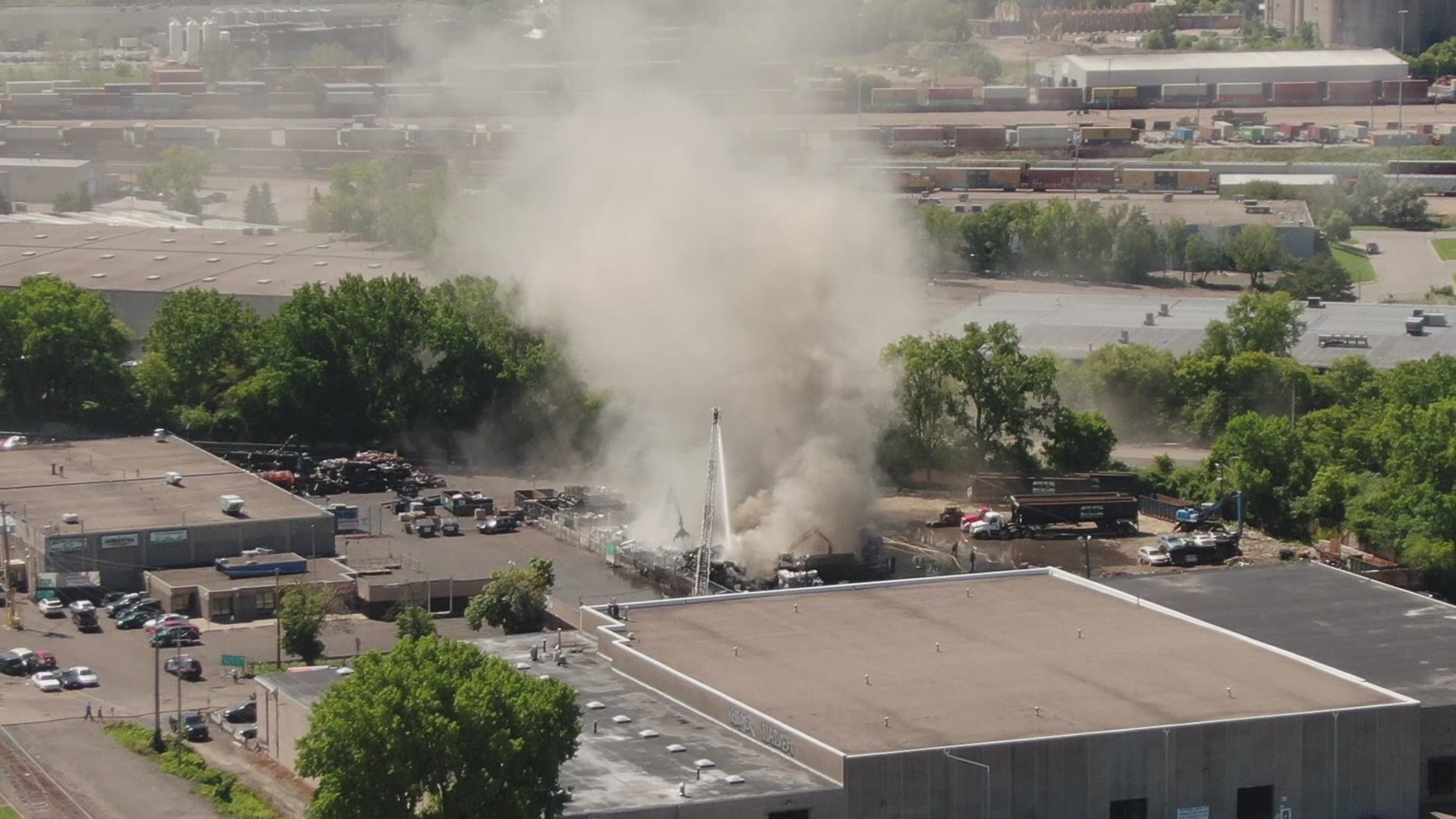 A large metal debris pile started on fire in St. Paul Tuesday near the border with Minneapolis, filling the sky with thick black smoke that could be seen for miles.