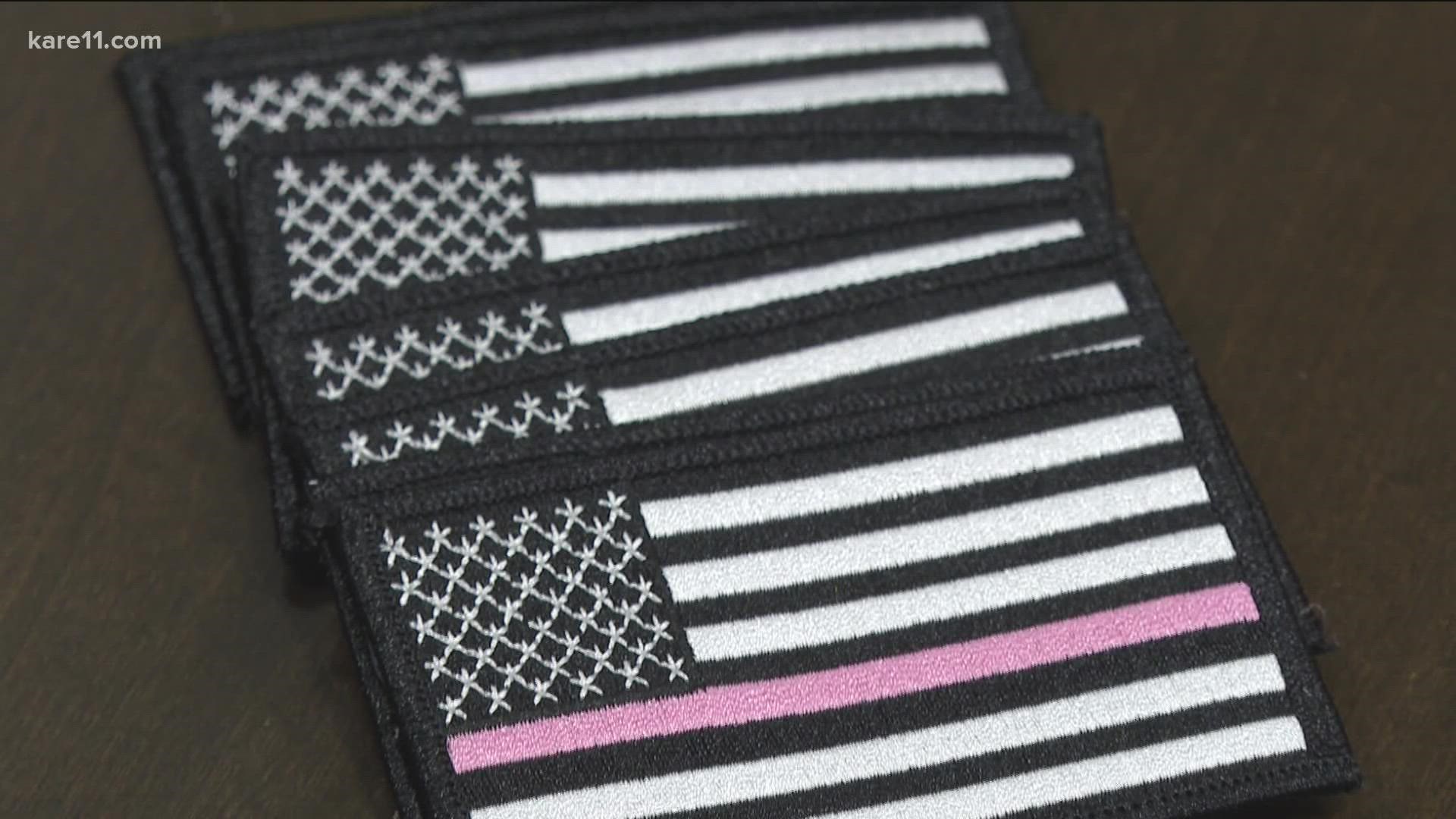 The thin blue line is carrying a different hue this month - a hint of pink to raise money and awareness of breast cancer.