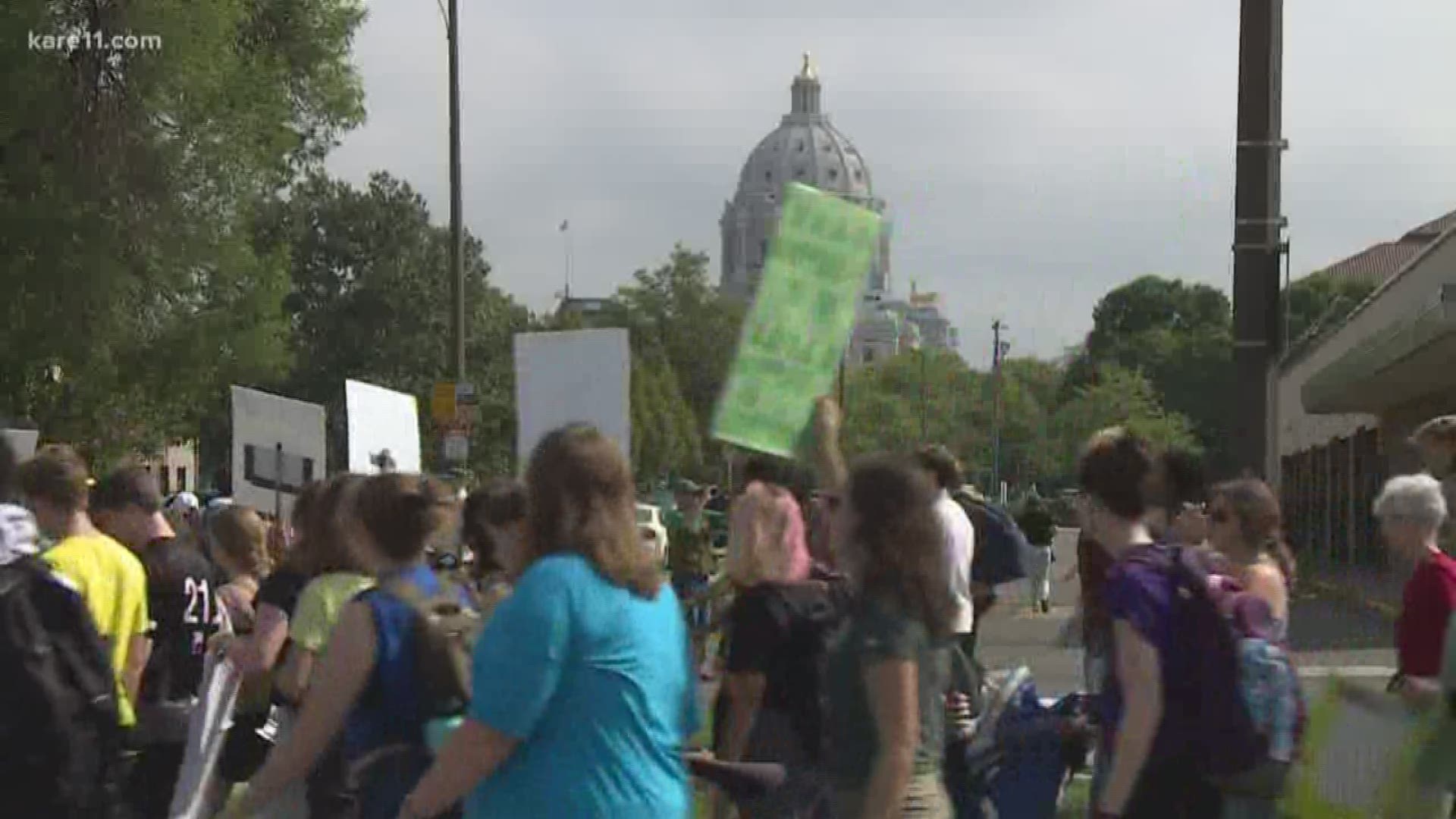 Thousands of protesters gathered at the State Capitol in St. Paul on Friday to call for government action to fight climate change.