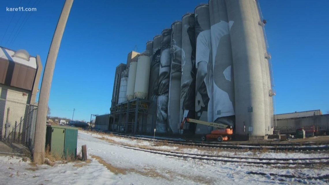 Artist paints giant mural on Mankato grain silos