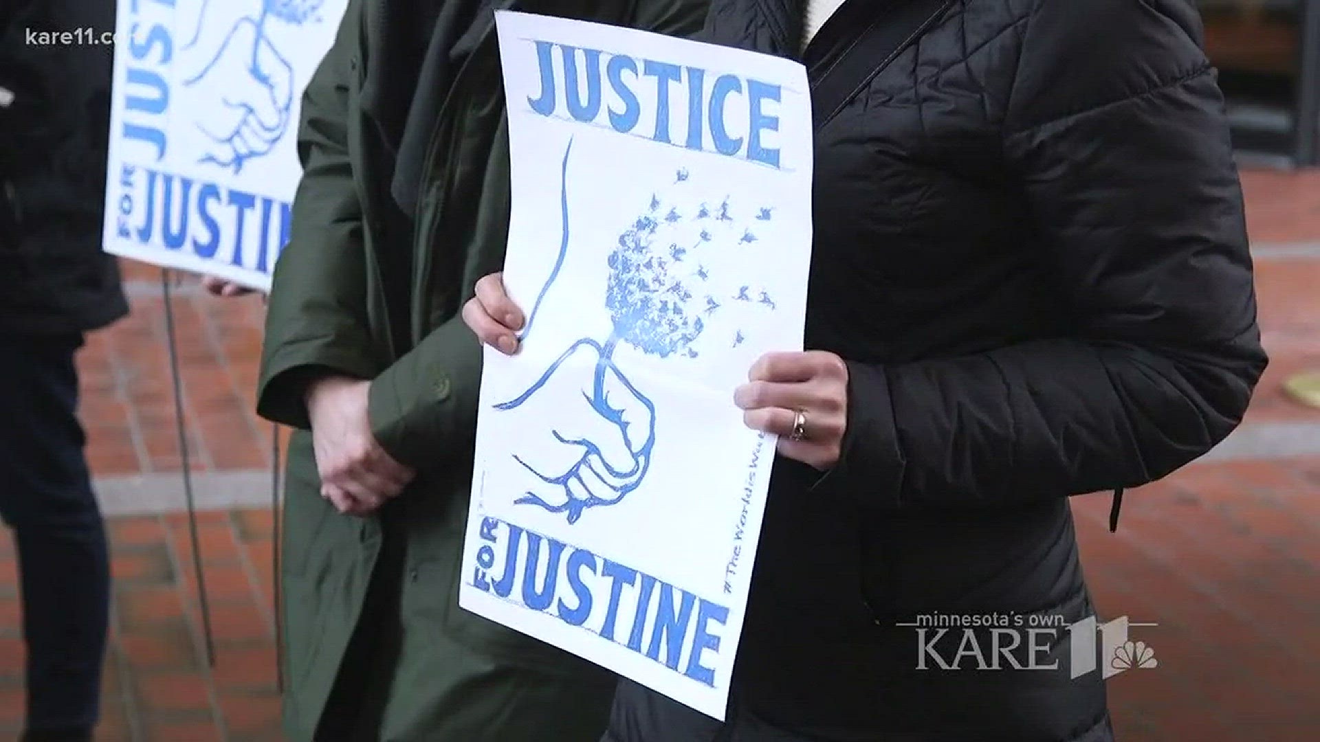 Several people gathered at the Hennepin County Courthouse Tuesday to rally for a decision on possible charges in the shooting death of Justine Damond.