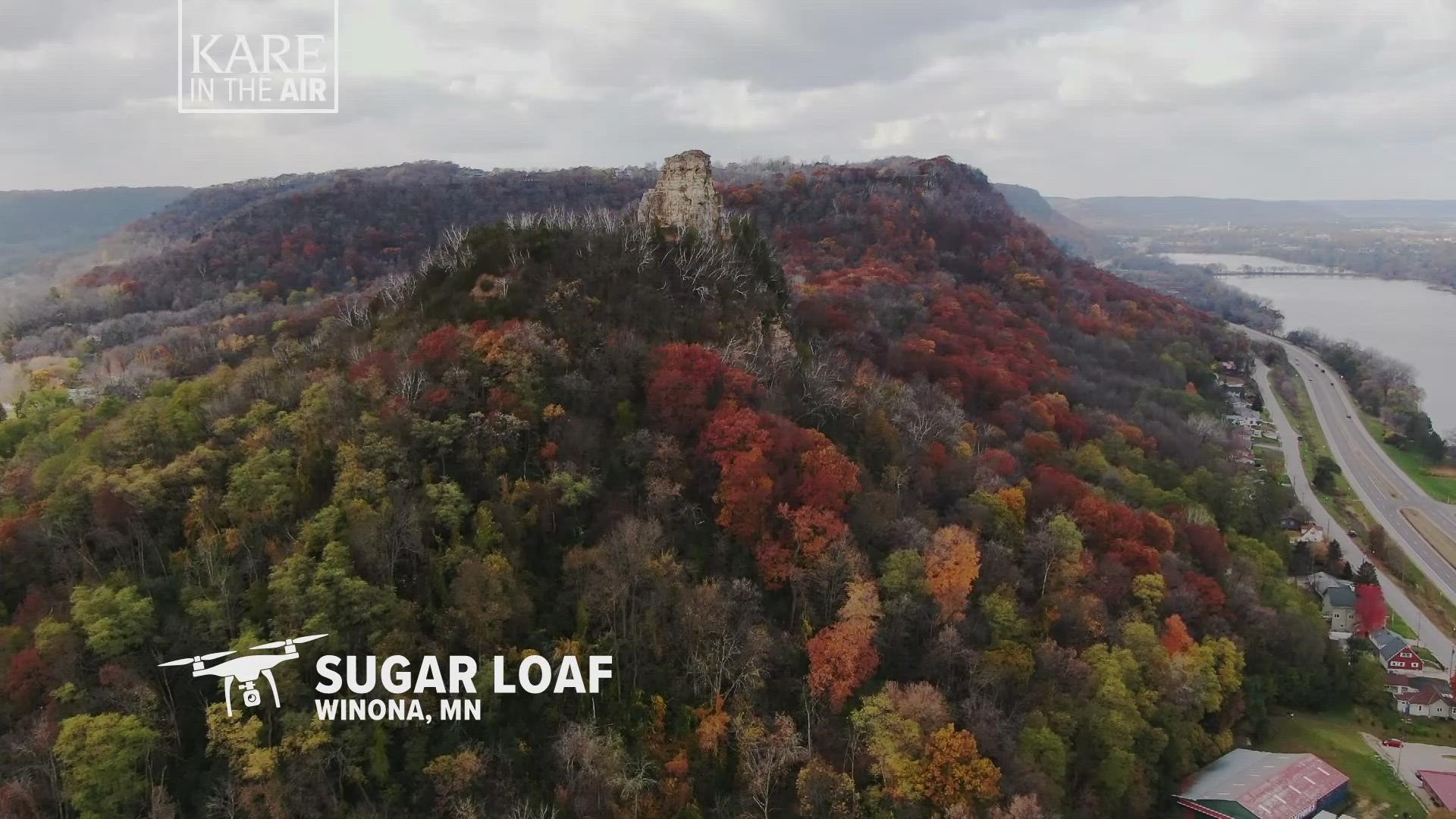 Sugar Loaf is a rocky limestone formation that towers some 580 feet above Lake Winona, a former channel of the Mississippi River as it winds through Winona County.