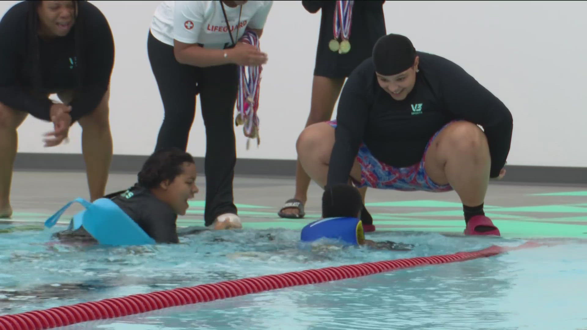 The class is the first to complete lessons, as part of the center's mission to teach the traditionally underserved community how to swim.