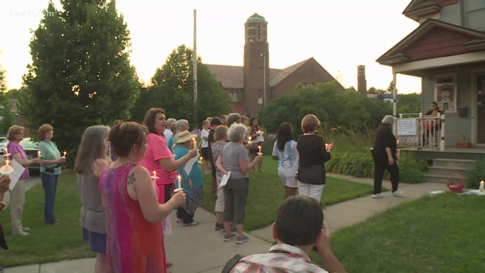 Protesters held a candle light vigil for St. Andrew's Church Sunday night.
