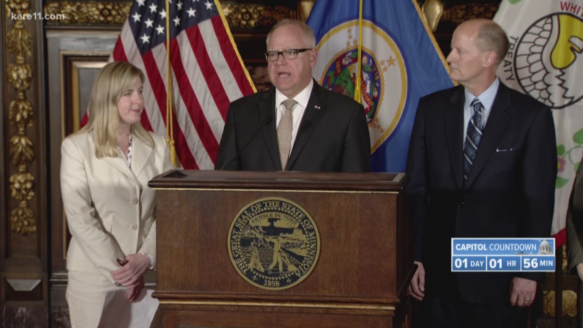 Minnesota Gov. Tim Walz and top legislative leaders have reached a bipartisan budget agreement that drops the governor's proposed gasoline tax increase but gives middle-class Minnesotans an income tax cut and preserves most of an expiring tax that funds health care.