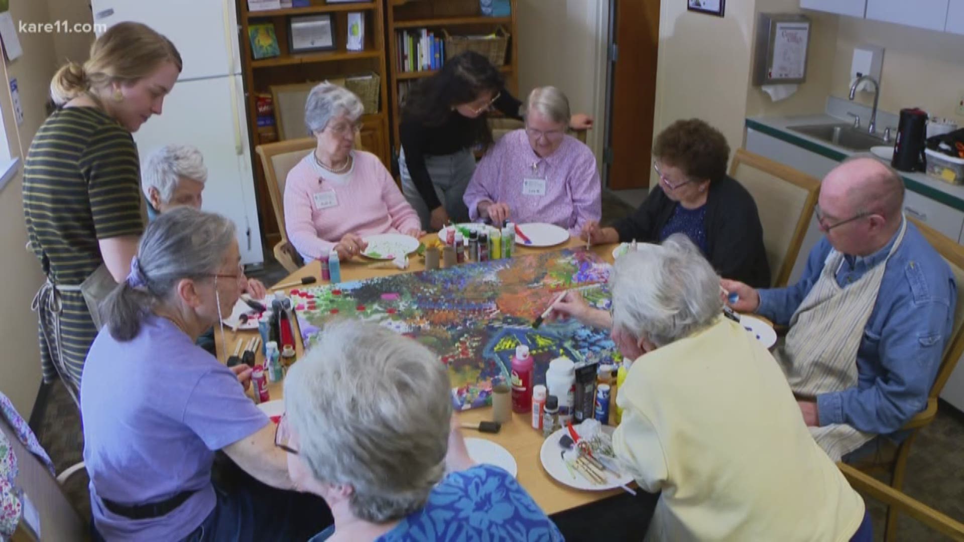 Tom Donnellan, an Open Circle member, is one of more than 15 people with dementia who are working on a process painting project.