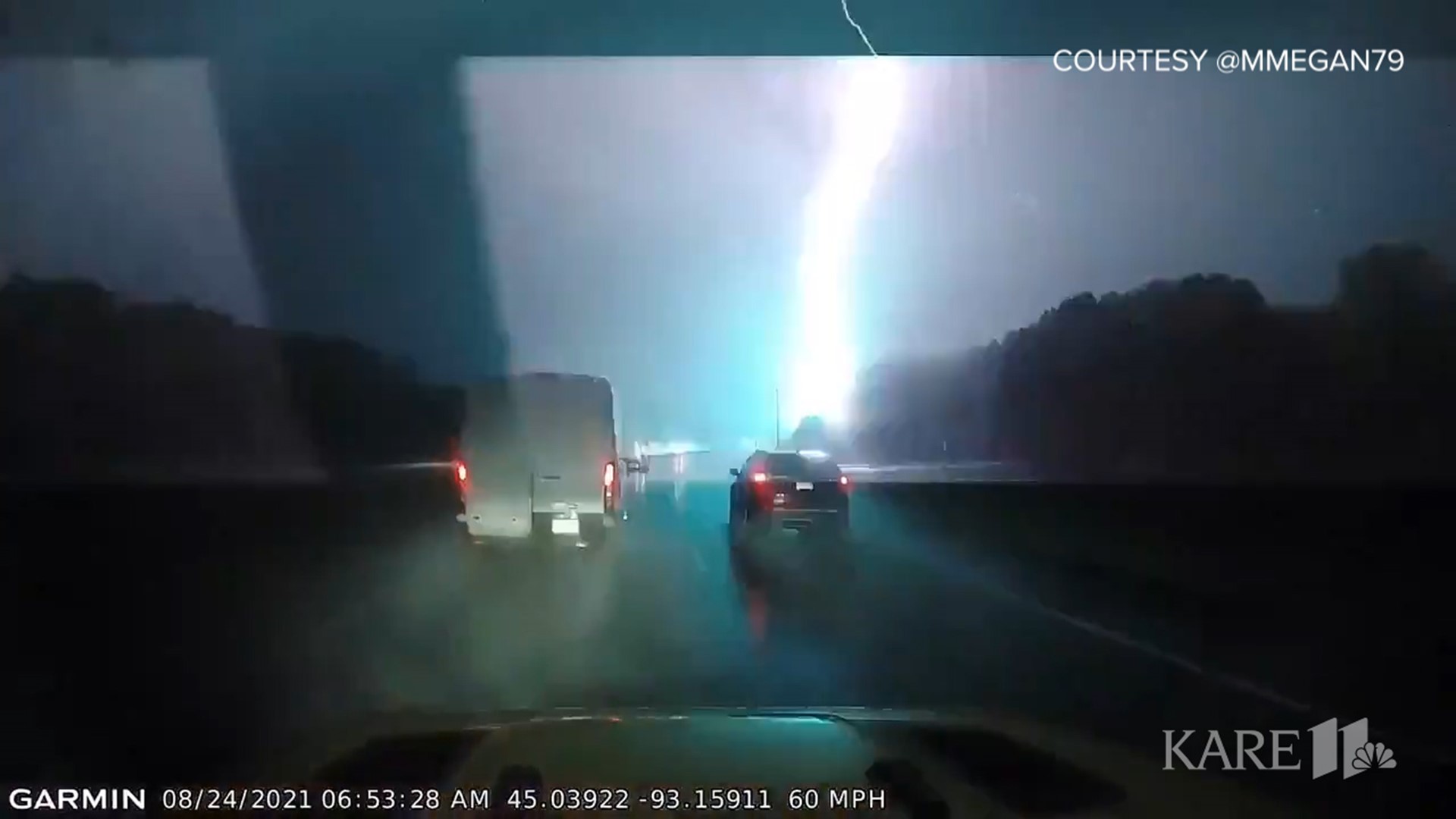 Twitter user @MMegan79 captured a massive lightning strike on dashcam video as severe storms pushed through Minnesota Tuesday morning.