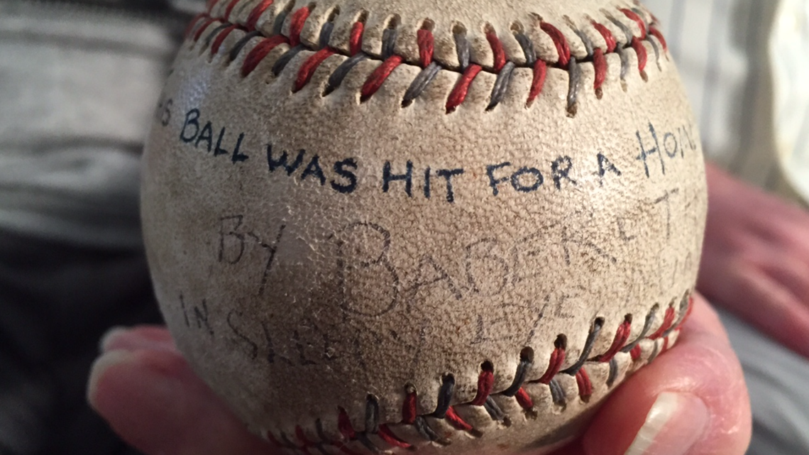 Babe Ruth in a baseball uniform shaking hands with a small boy — Calisphere