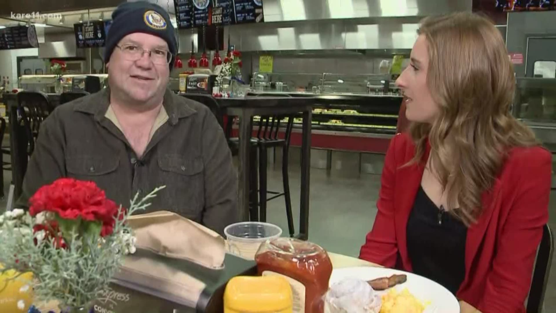 Ellery McCardle eats breakfast with a veteran at Hy-Vee. https://kare11.tv/2qGZQkR