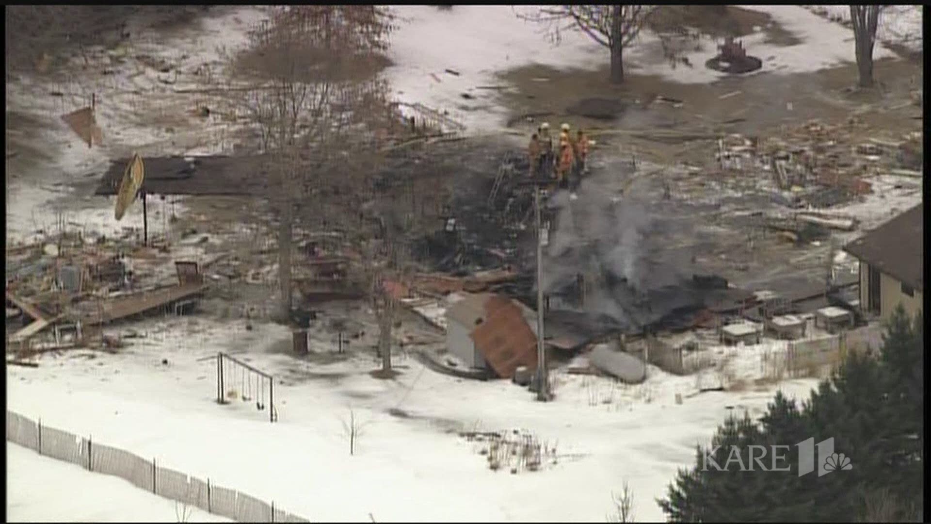 Sheriff's officials say one person is dead and another is severely burned after a house explosion in Dakota County early Tuesday morning.