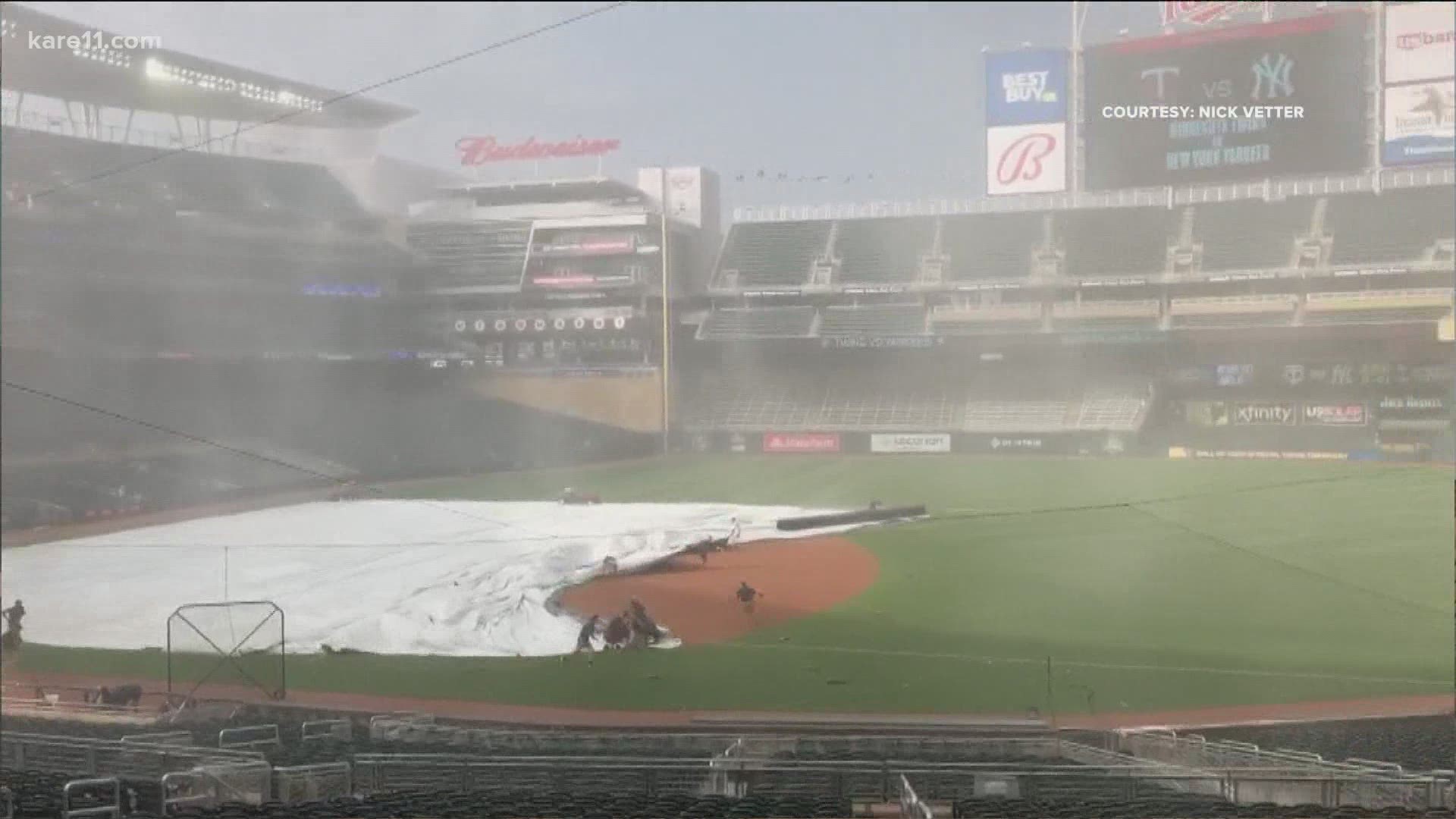 Winds were so strong the Twins almost lost the tarp off their field