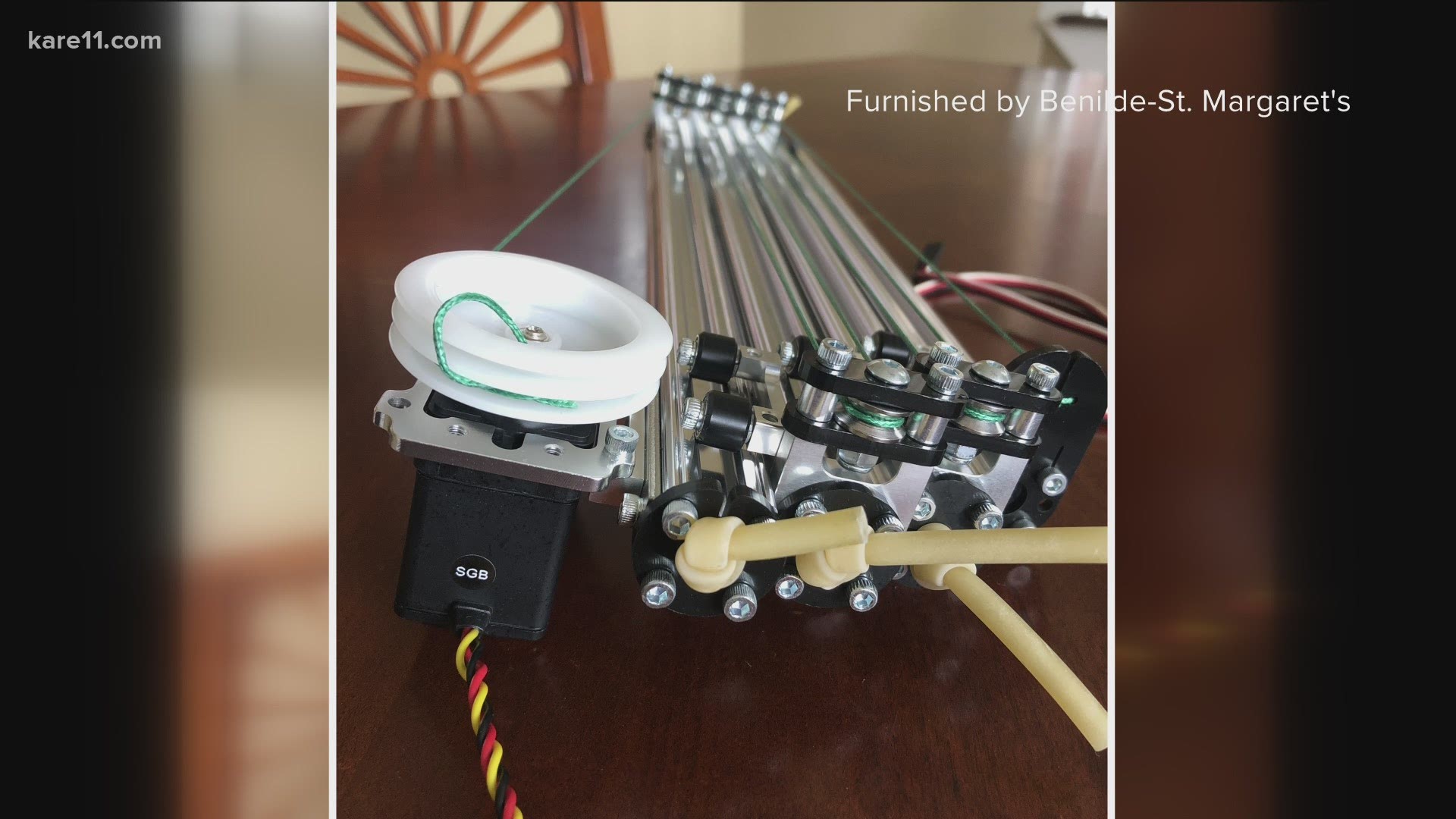Engineering students in Benilde-St. Margaret's InvenTeam have created a robotic arm to help people who use electric wheelchairs extend their reach.