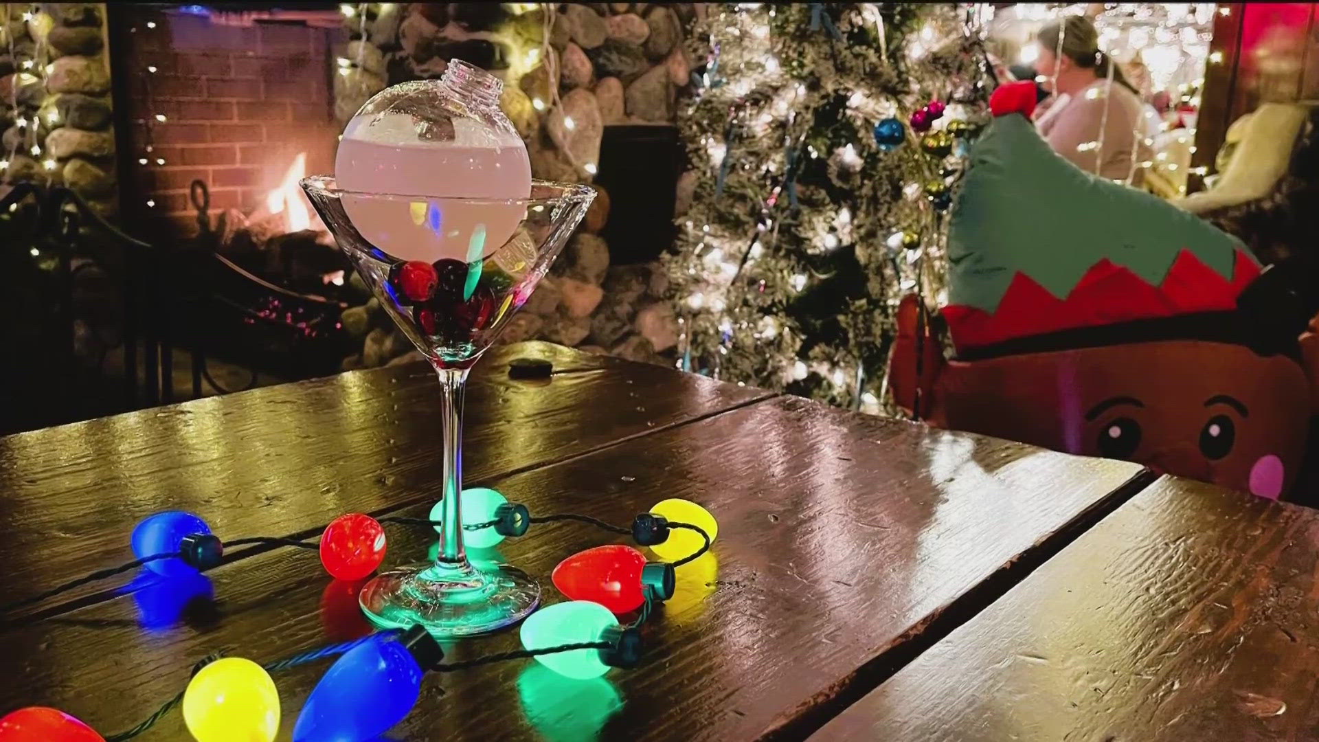 Shaken and strained into an ornament ball. Placed into a martini glass with cranberries and a lime wedge.