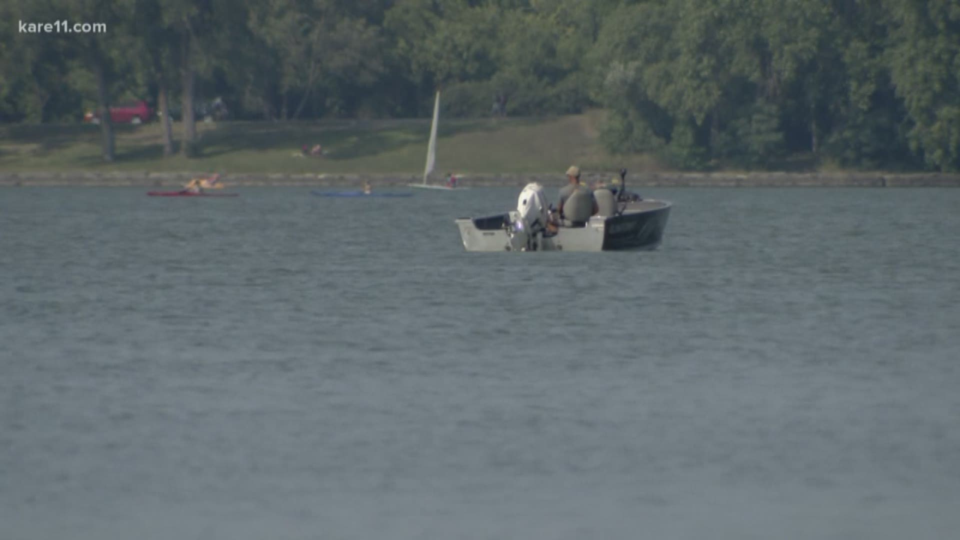 Witnesses said a man was retrieved from under the floating dock near the Linden Hills side of the lake. He was given CPR by the lifeguard and others and a man with a boat was able to get him to shore to the police and ambulance.