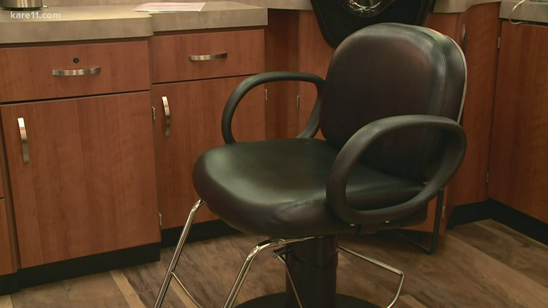 The general manager of Sola Salon Studios in Edina says he's waiting on clarification from the Board of Cosmetology.