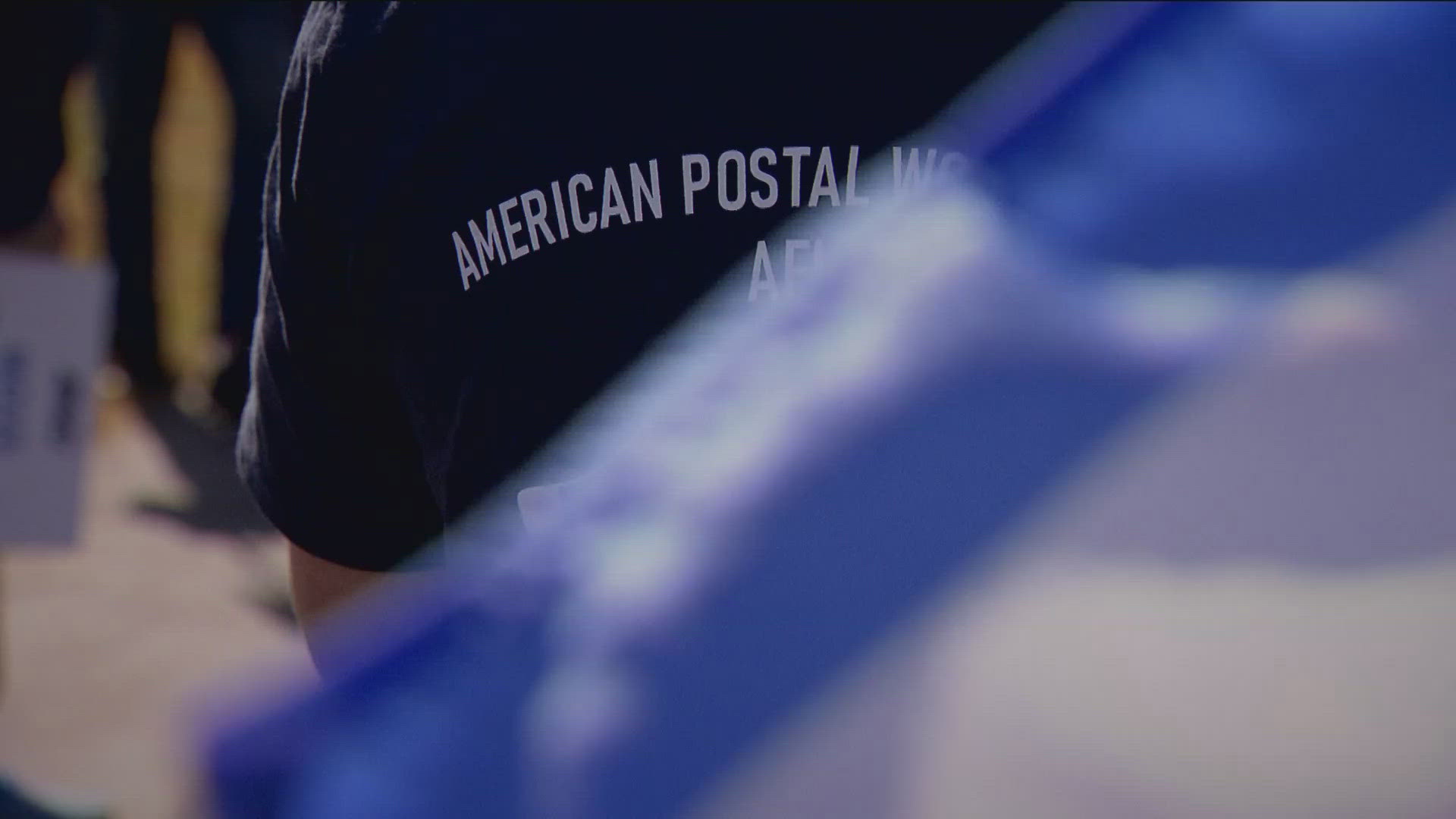 Dozens of American Postal Workers Union members gathered outside the Eagan post office in solidarity Tuesday, calling for change around reduced staffing levels.