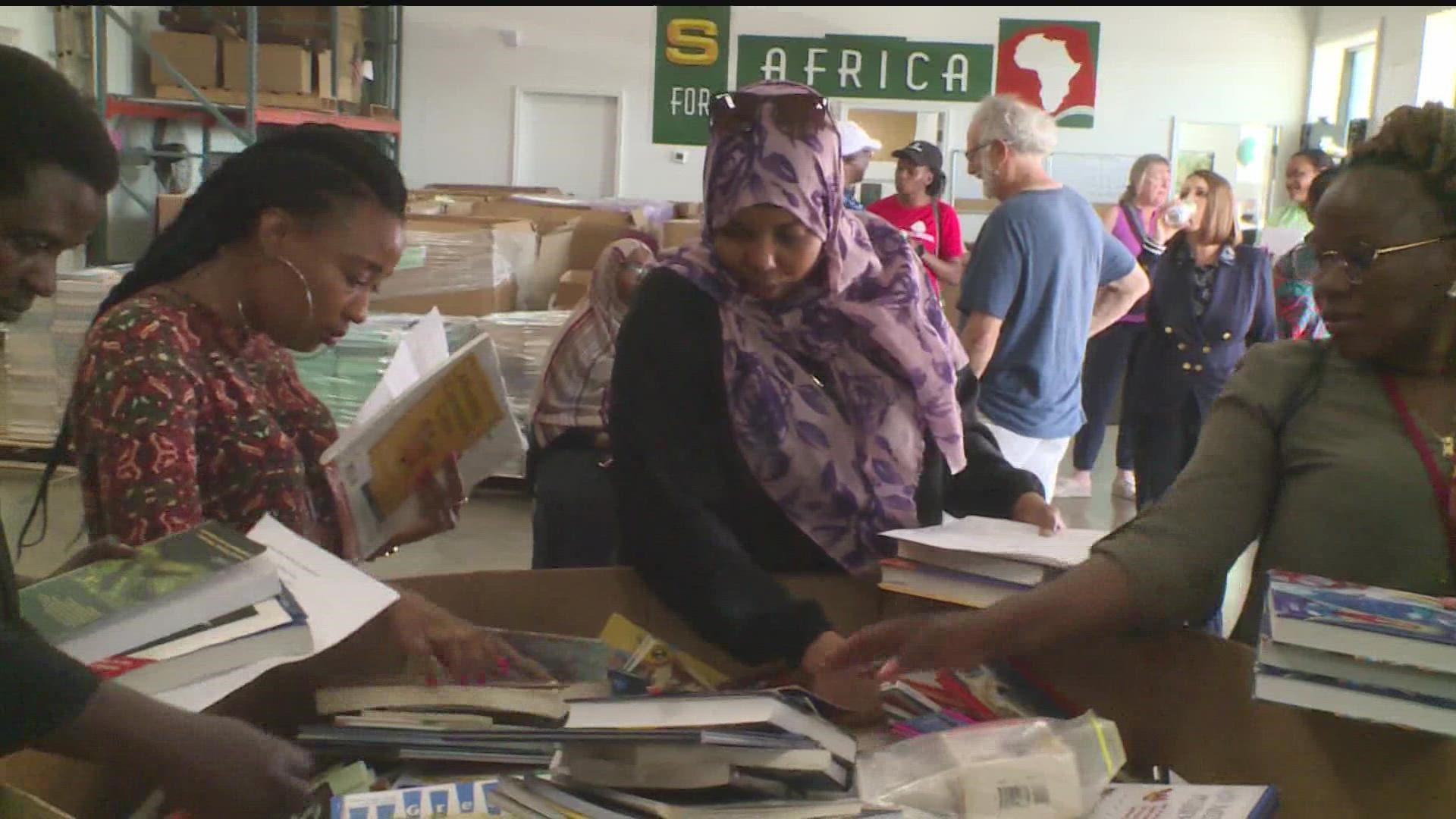 Twenty-four African leaders from 15 different countries sorted and packed books at the Books for Africa warehouse as part of the Mandela Washington Fellowship.