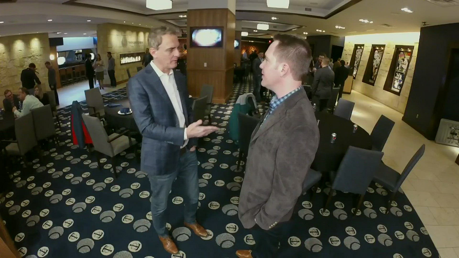 New Twins CBO Derek Falvey chats with Eric Perkins at Friday's Twin Luncheon