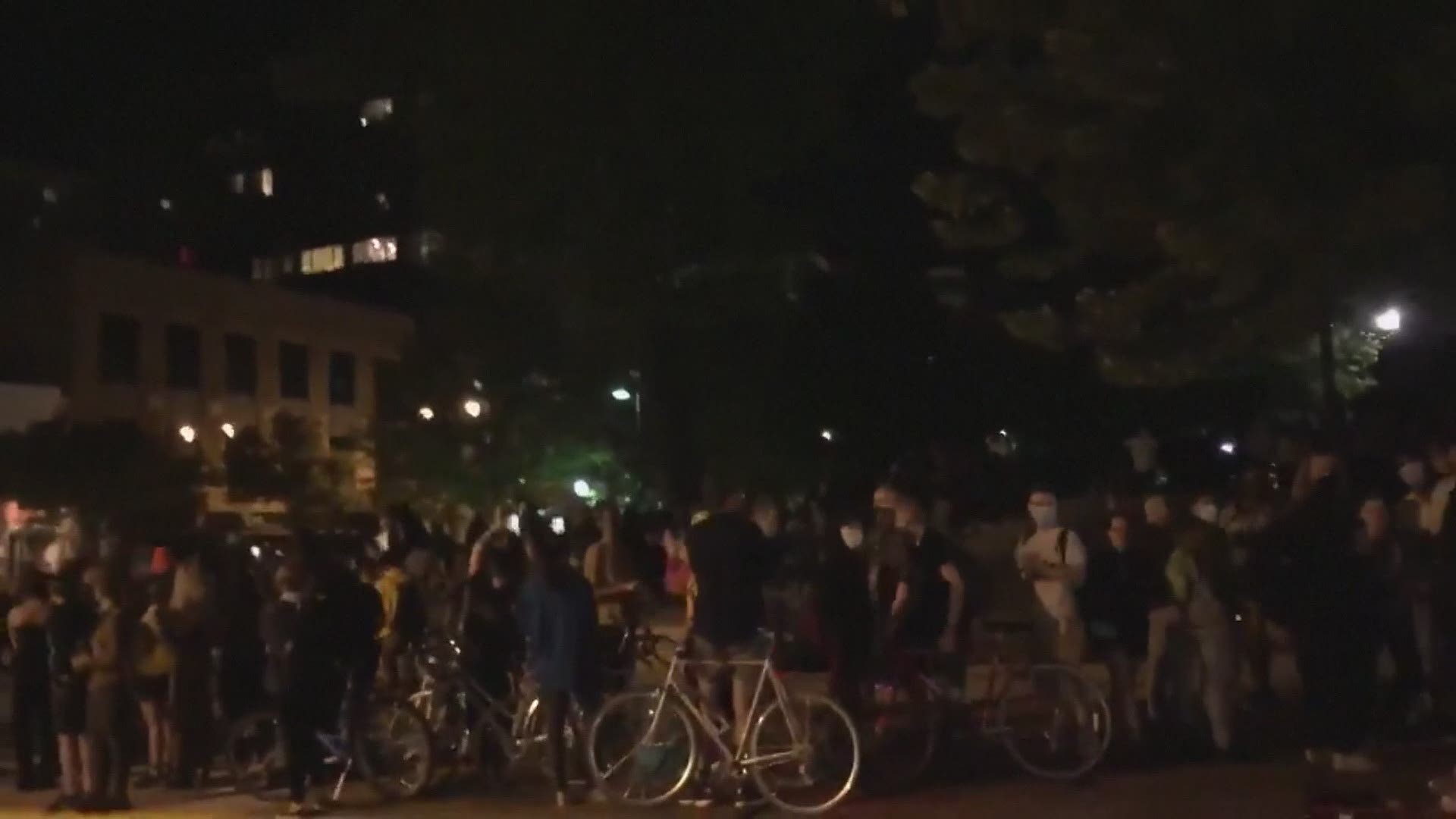 Demonstrators toppled a pair of statues and reportedly attacked a state senator taking pictures of the incident in downtown Madison, Wis. Tuesday.