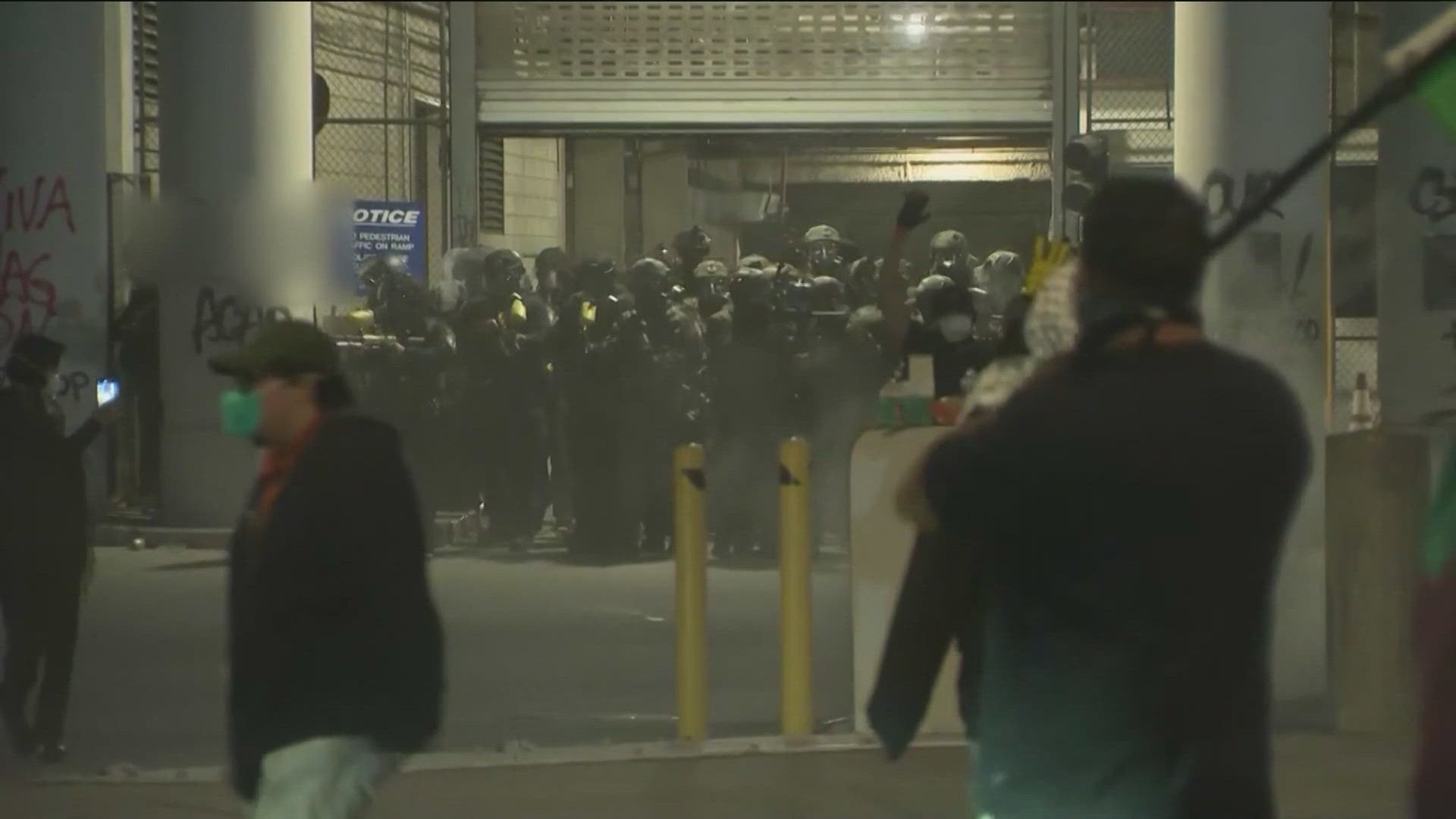 Troops were stationed outside the Metropolitan Detention Center in downtown Los Angeles, dressed in tactical gear and holding long guns Sunday.