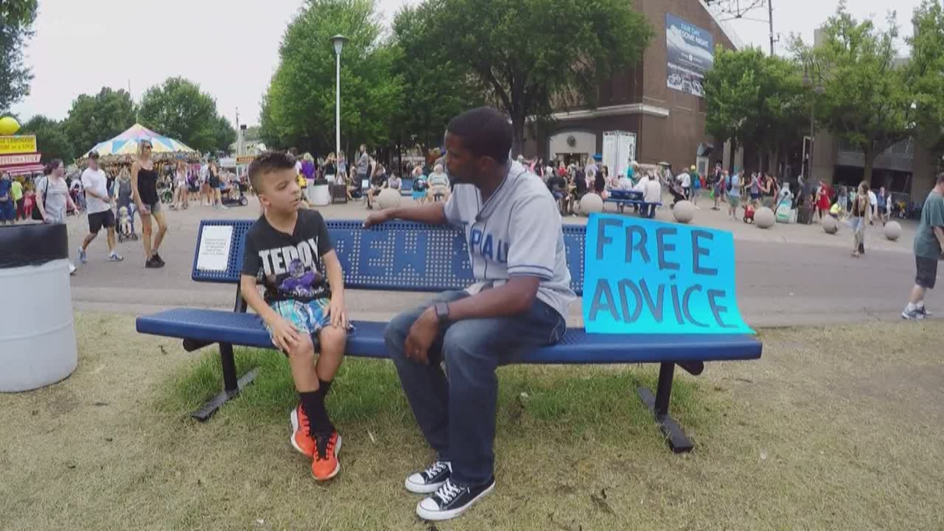 a politician stopping by a booth for free advice from a 9-year-old at the great Minnesota Get-Together?