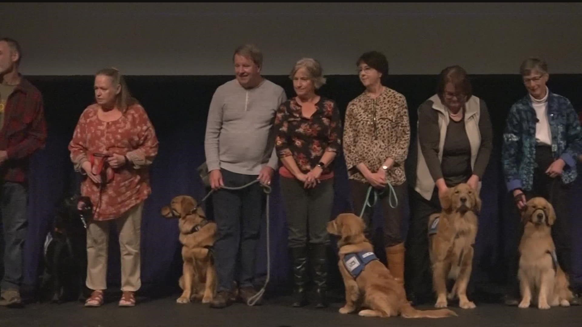 A long overdue in-person graduation ceremony was held for more than two dozen dogs who are part of Helping Paws.