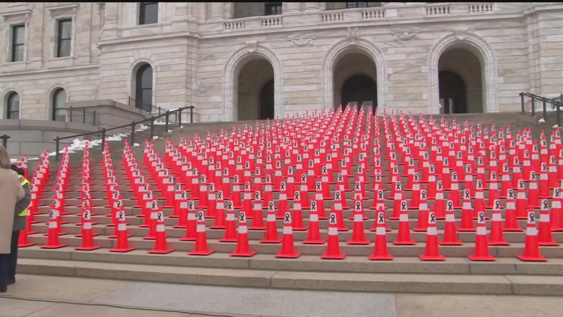 502 traffic cones lined the capitol steps to signify those who died on Minnesota roads in 2021.