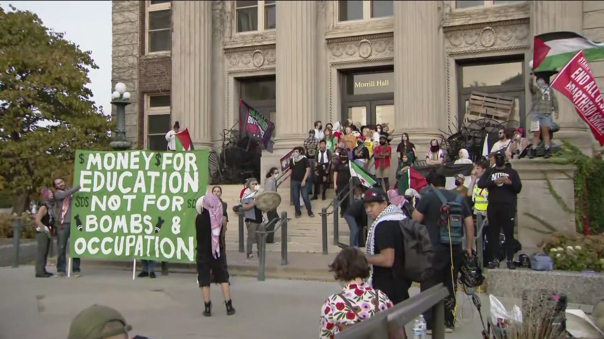 University officials say the protestors entered the building and are causing property damage and restricting people from entering and exiting the building.