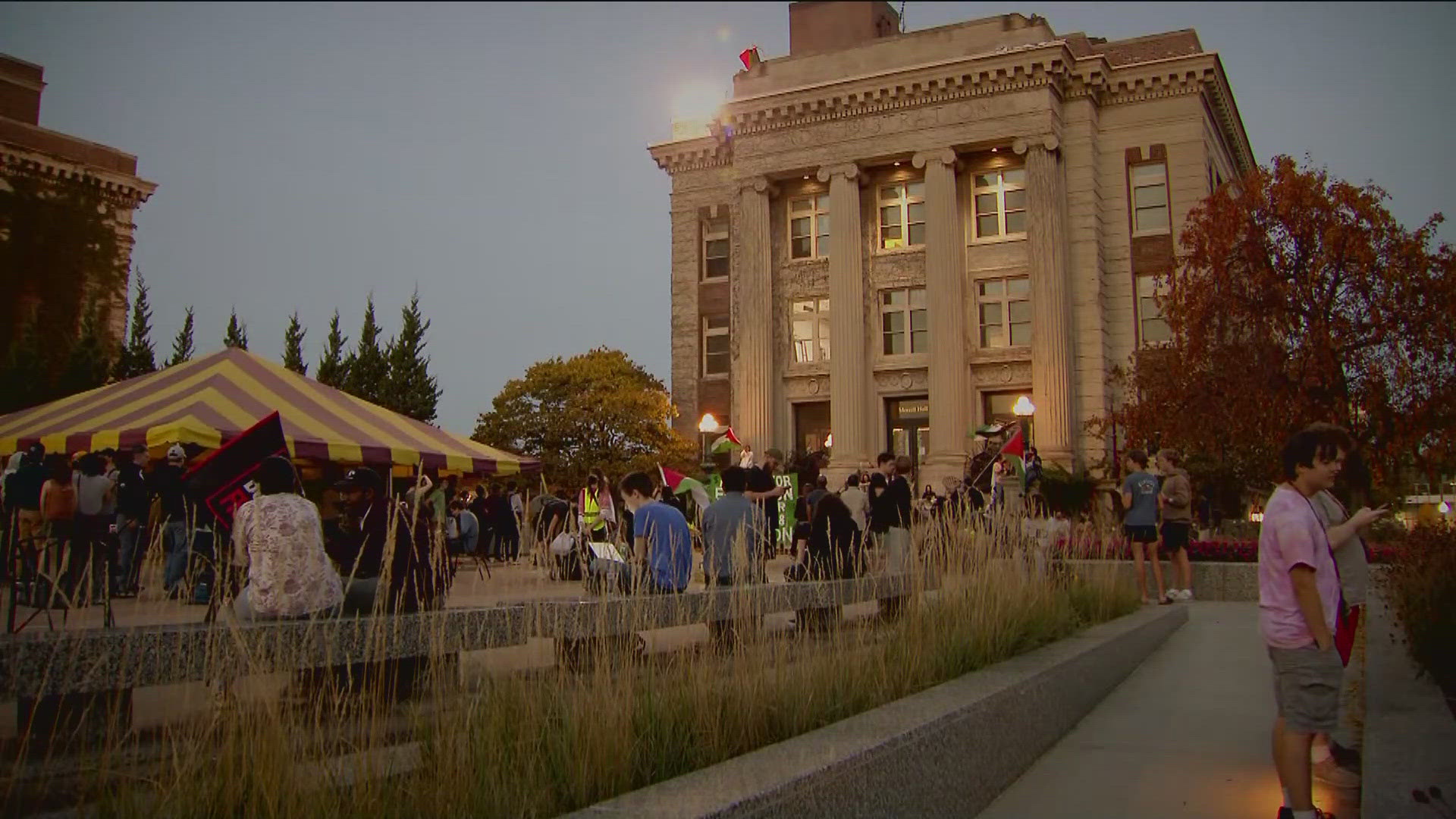 University officials say the protesters entered the building and caused property damage, including spray paint in the building and windows being broken.