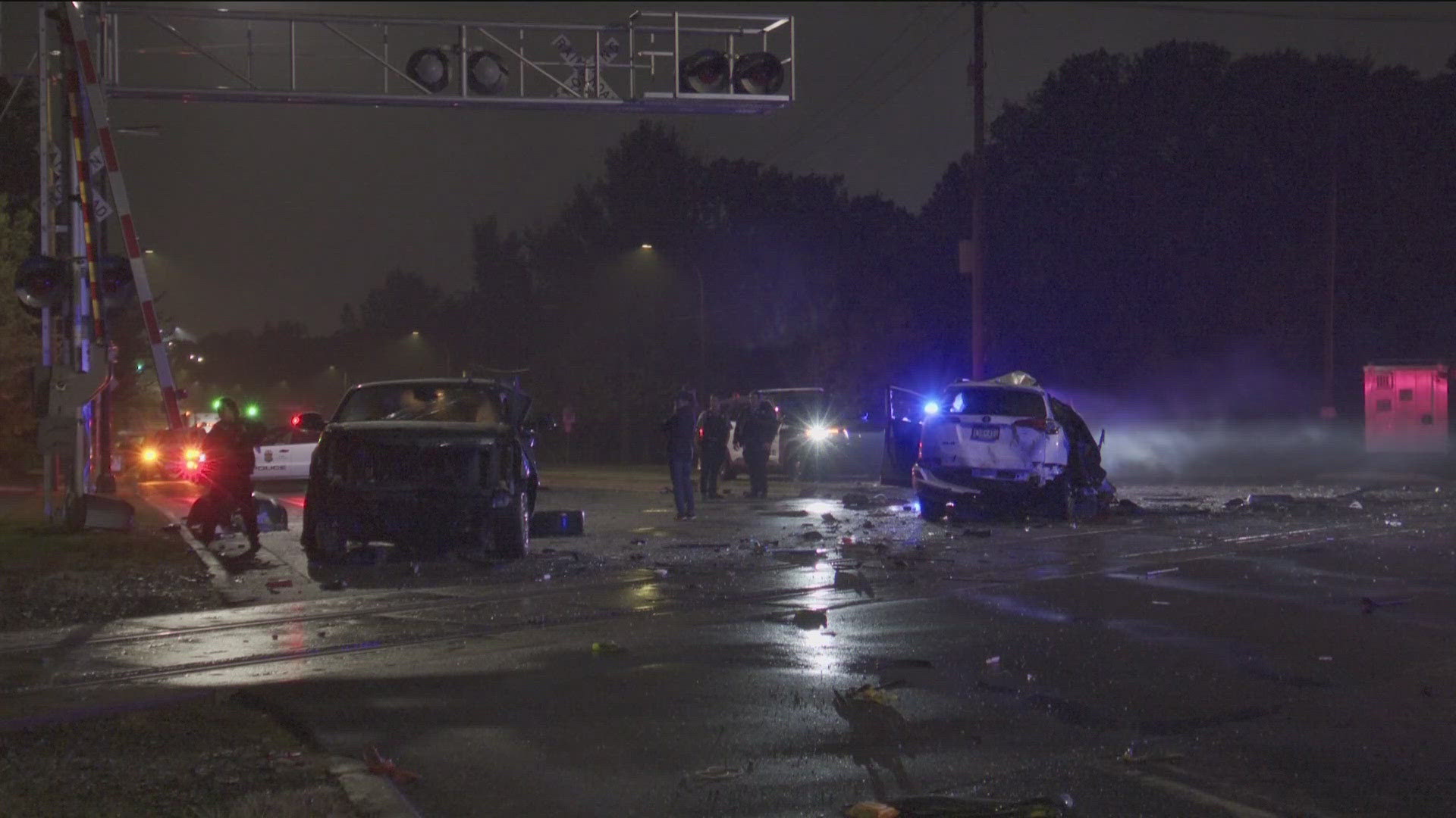 A passenger told KARE 11 that a car rear-ended another, pushing it into a moving train early Wednesday morning. 