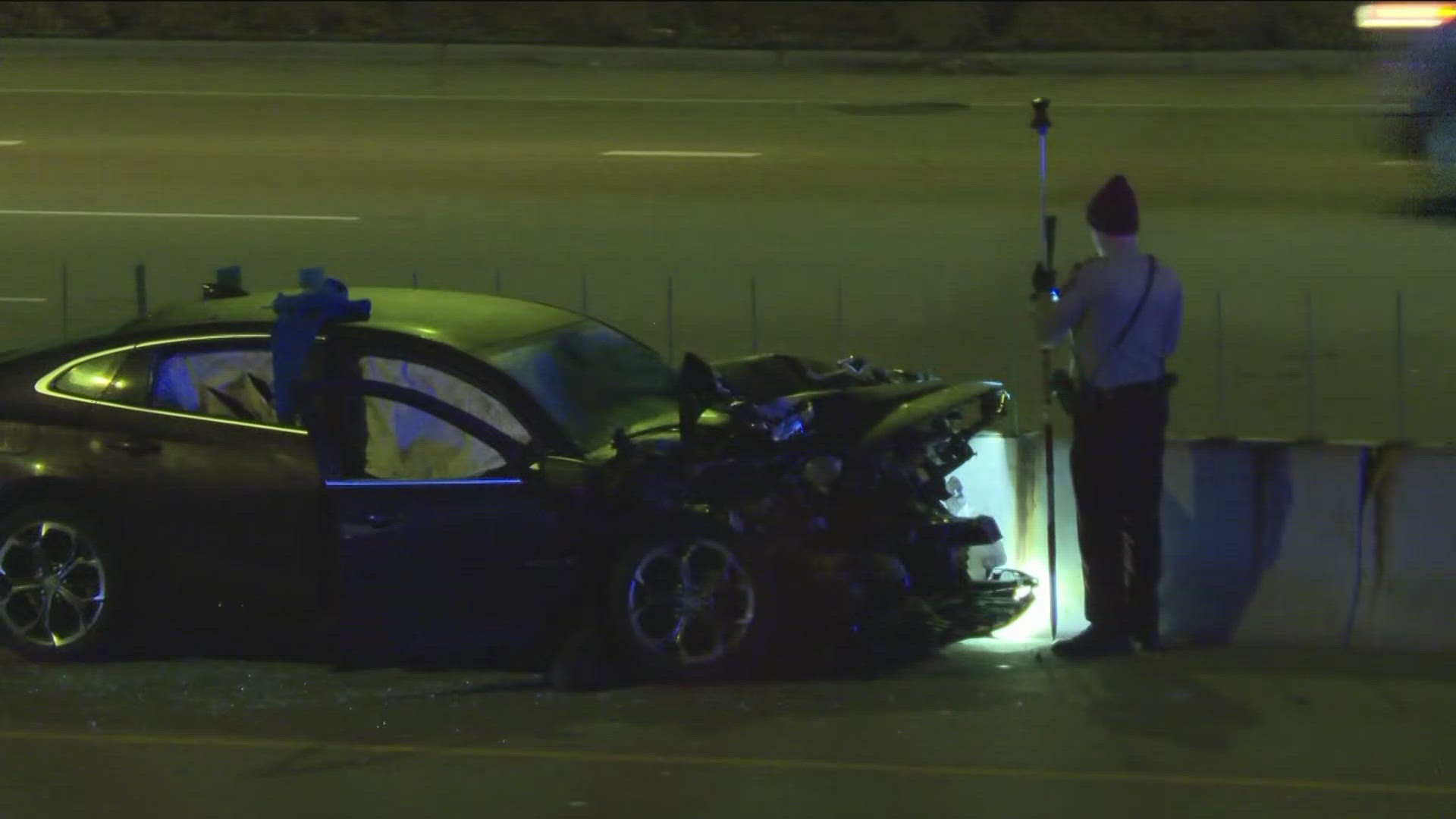 A heavily damaged sedan sat on the center median of the interstate near the exit to 5th/7th Avenues in South St. Paul while all eastbound lanes were closed.