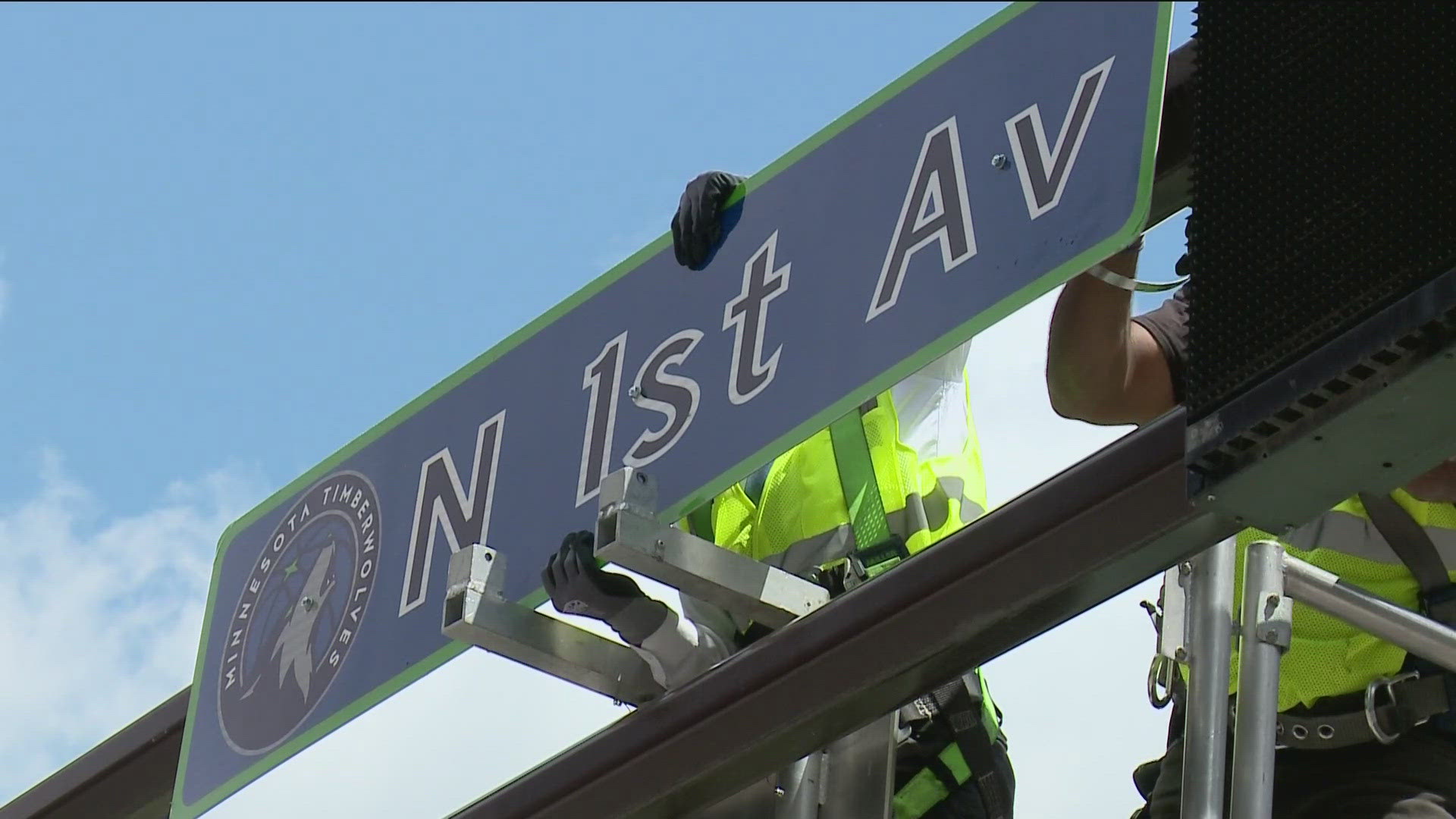 The signs feature the team's colors and logo at two intersections — First Ave. & Sixth Street and First Ave. & Seventh St.