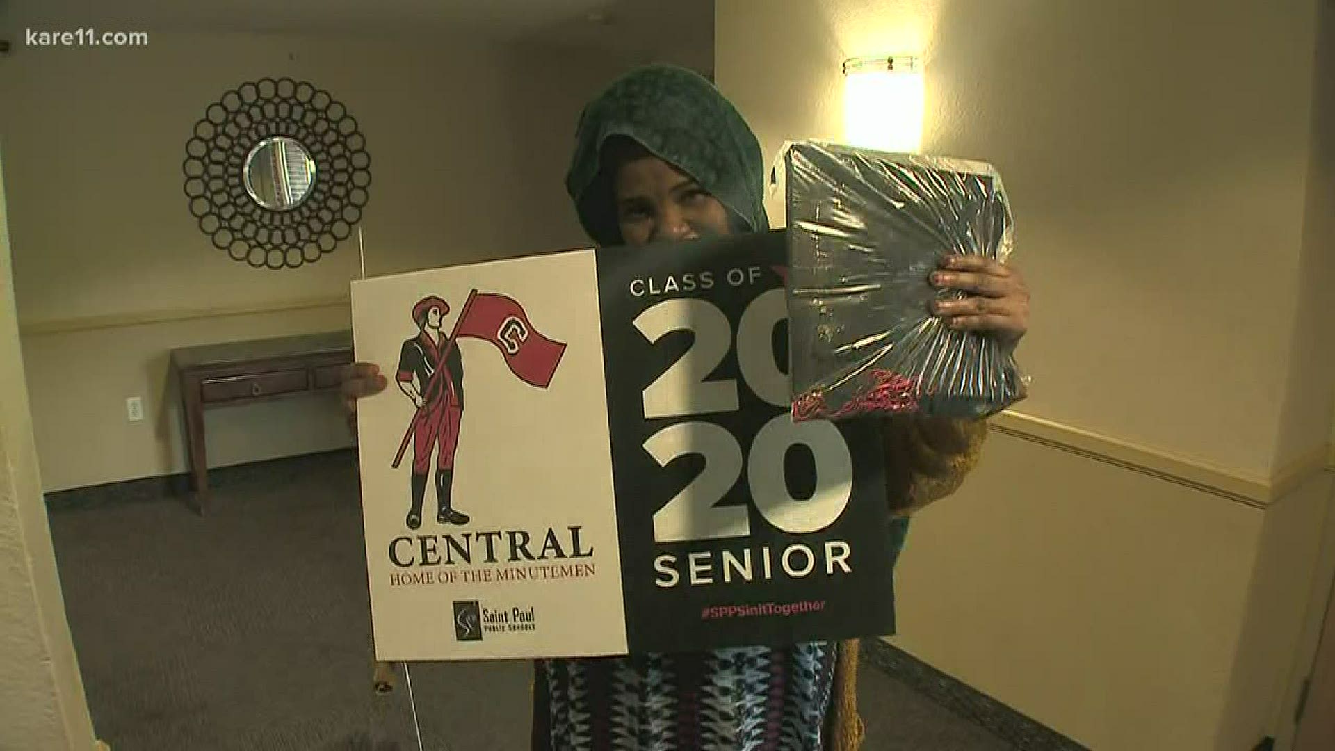 St. Paul school leaders delivered the caps, gowns and yard signs ahead of this year's virtual graduation ceremonies.