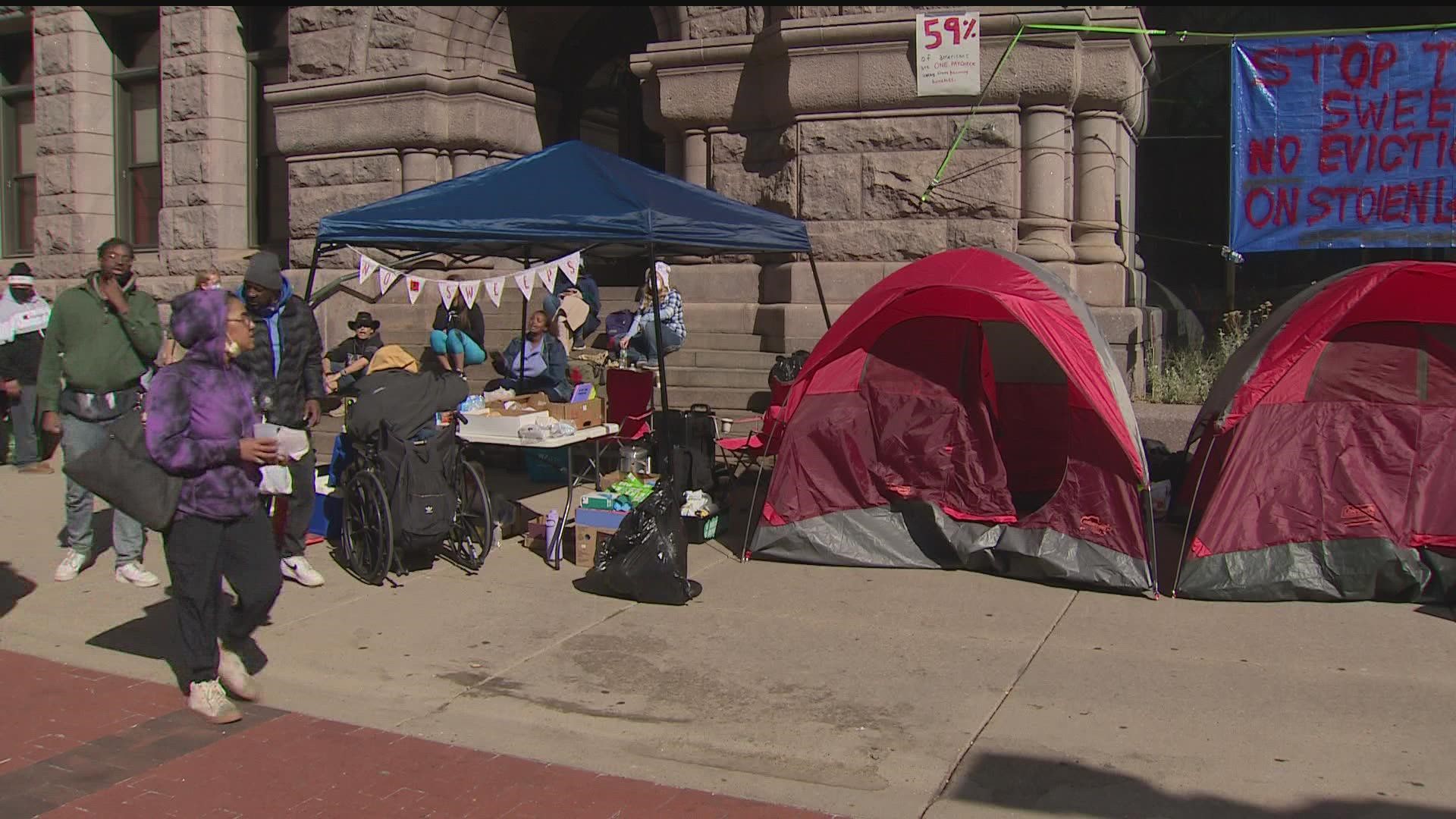 Advocates say they'll stay for "as long as it takes," asking the city to provide for those displaced after a homeless encampment was cleared on Thursday morning.