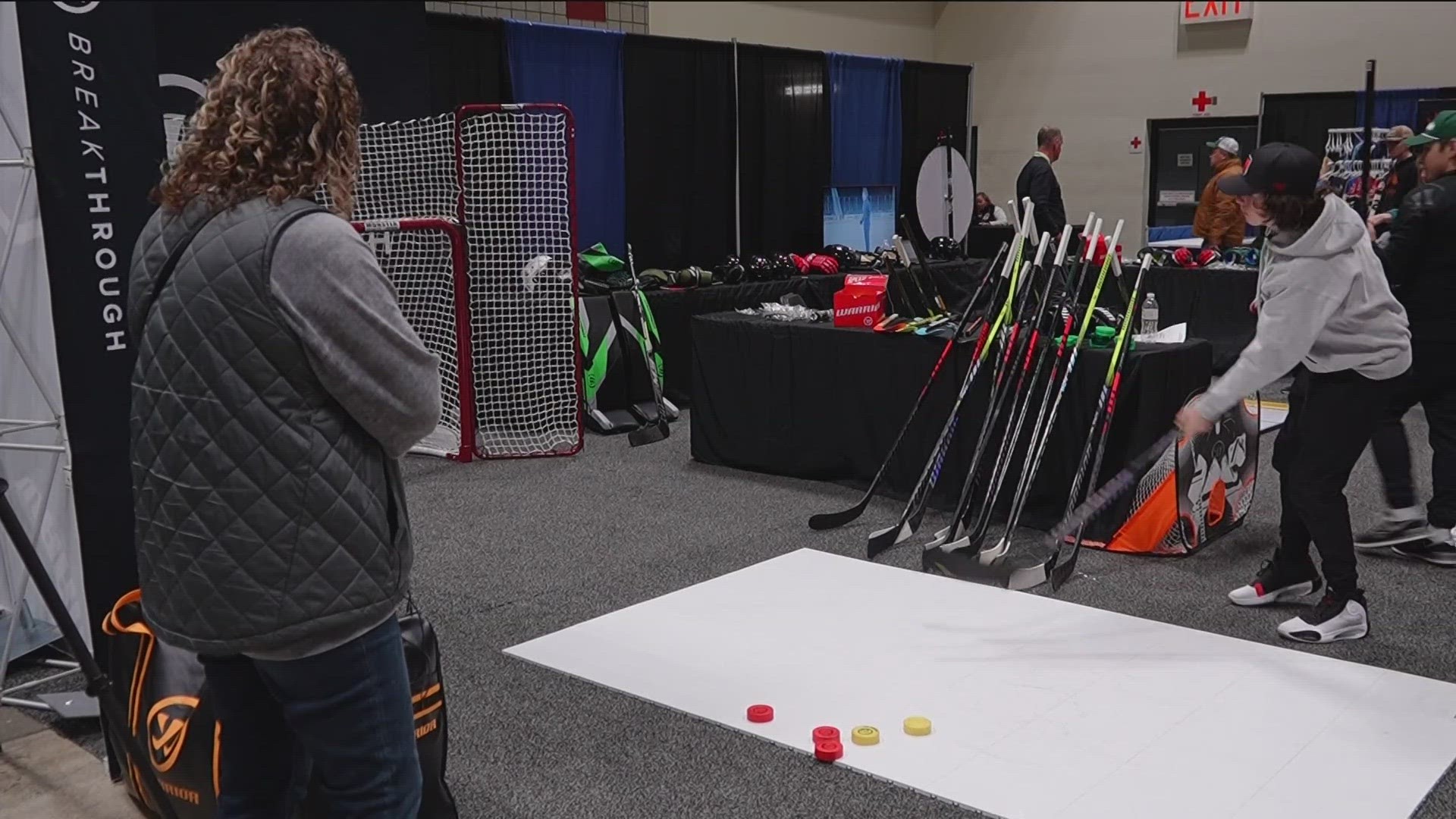 Among other hockey experiences, the expo features an interactive game that tests the hockey skills of kids and adults.