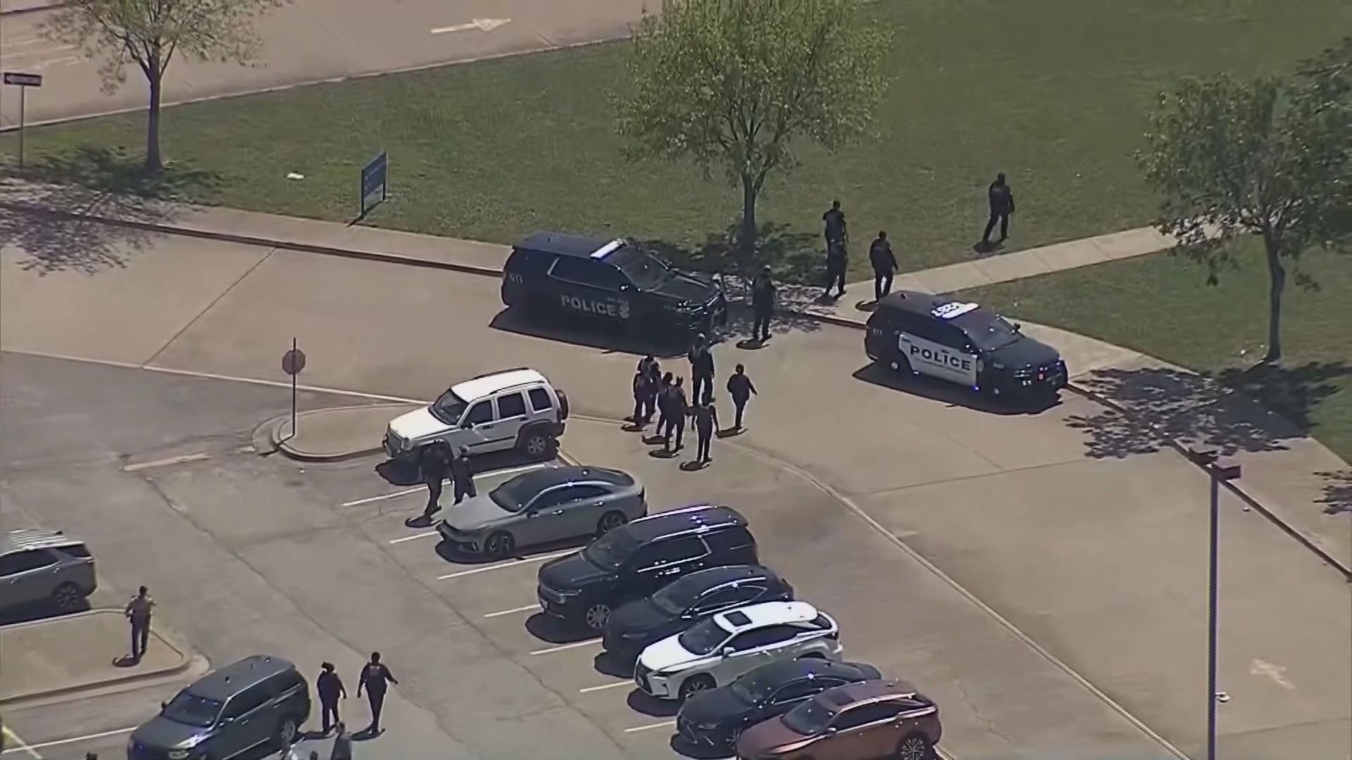 A suspect is in custody following an hours-long manhunt in Texas after authorities say a shooter opened fire at a Dallas high school.