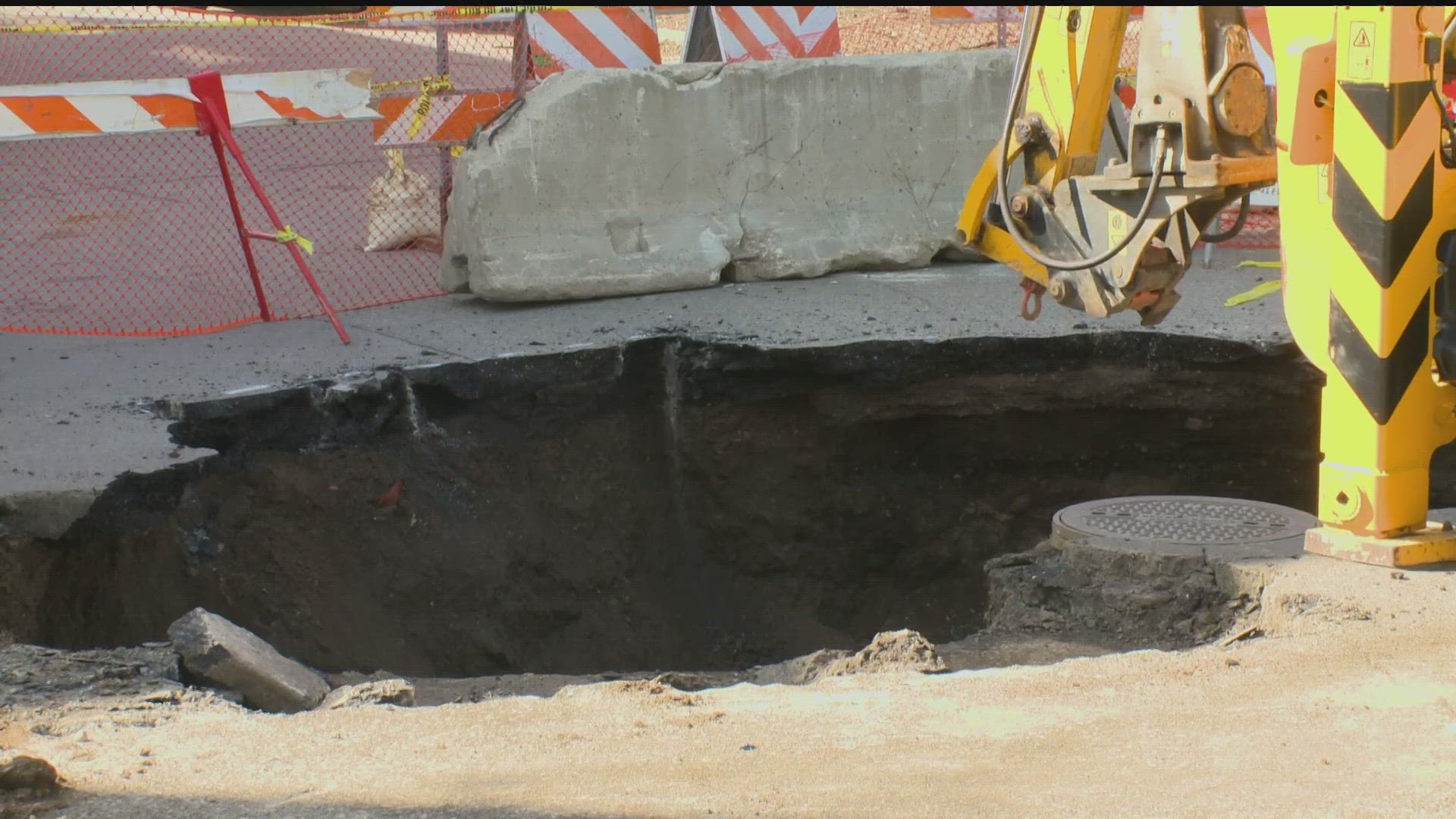 Officials said Monday the sinkhole was caused by a collapsed sewer main, adding that crews are planning to repair the sinkhole and intersection as soon as possible.