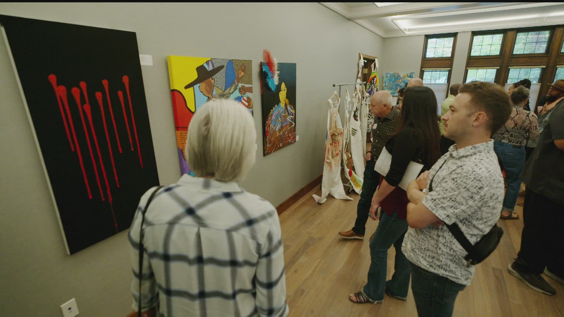 The exhibit, which opened Sunday at Grace Trinity Community Church, intends to bring people together for "justice, healing and peace."