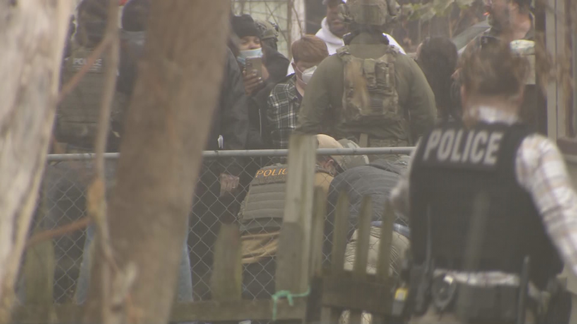 A witness said the number of agents "just kept growin' and growin' and growin," as did an angry crowd that was eventually sprayed with chemical irritants.