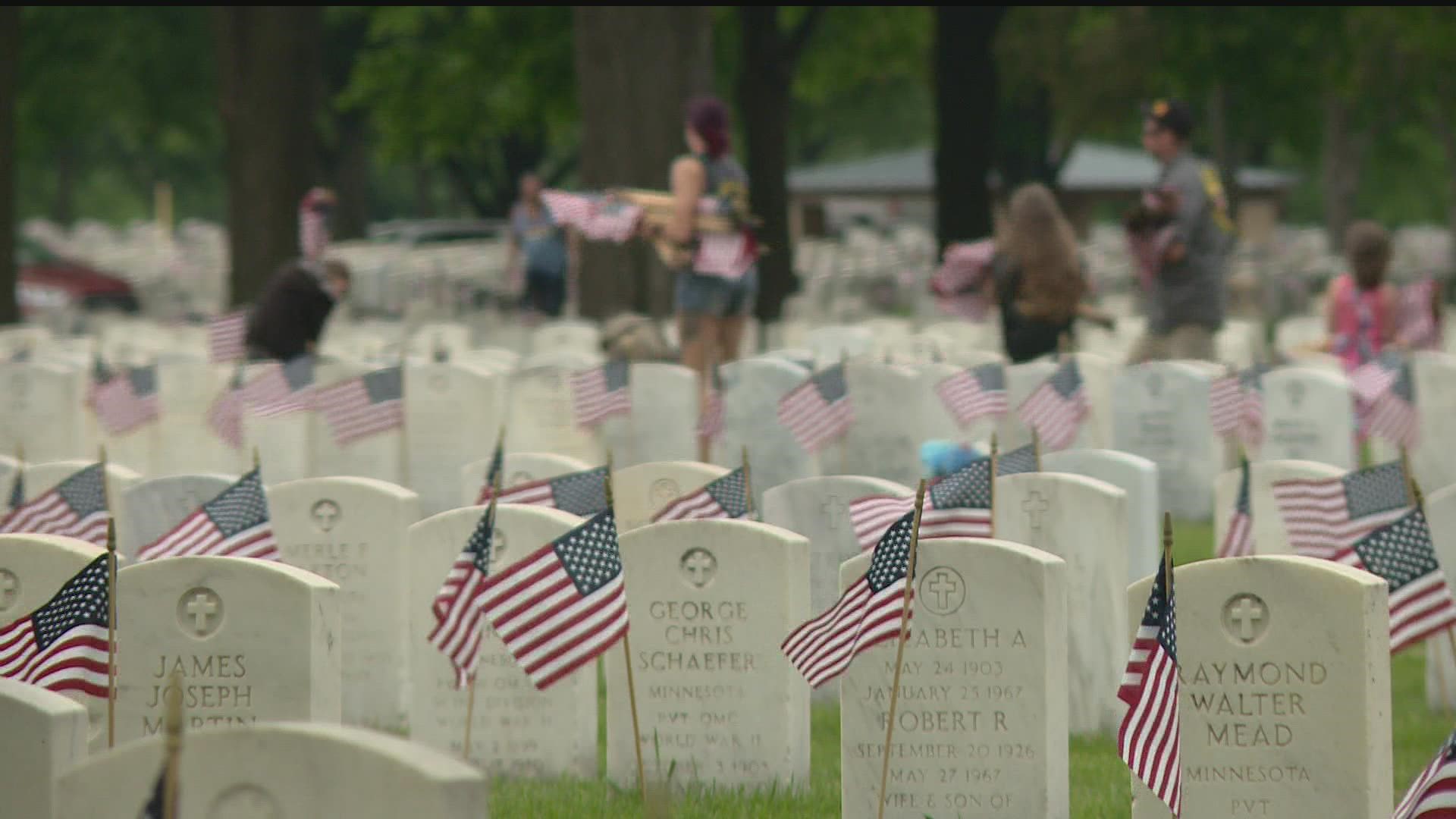 Volunteers with Flags for Fort Snelling began their work at the crack of dawn on Sunday in advance of Memorial Day.